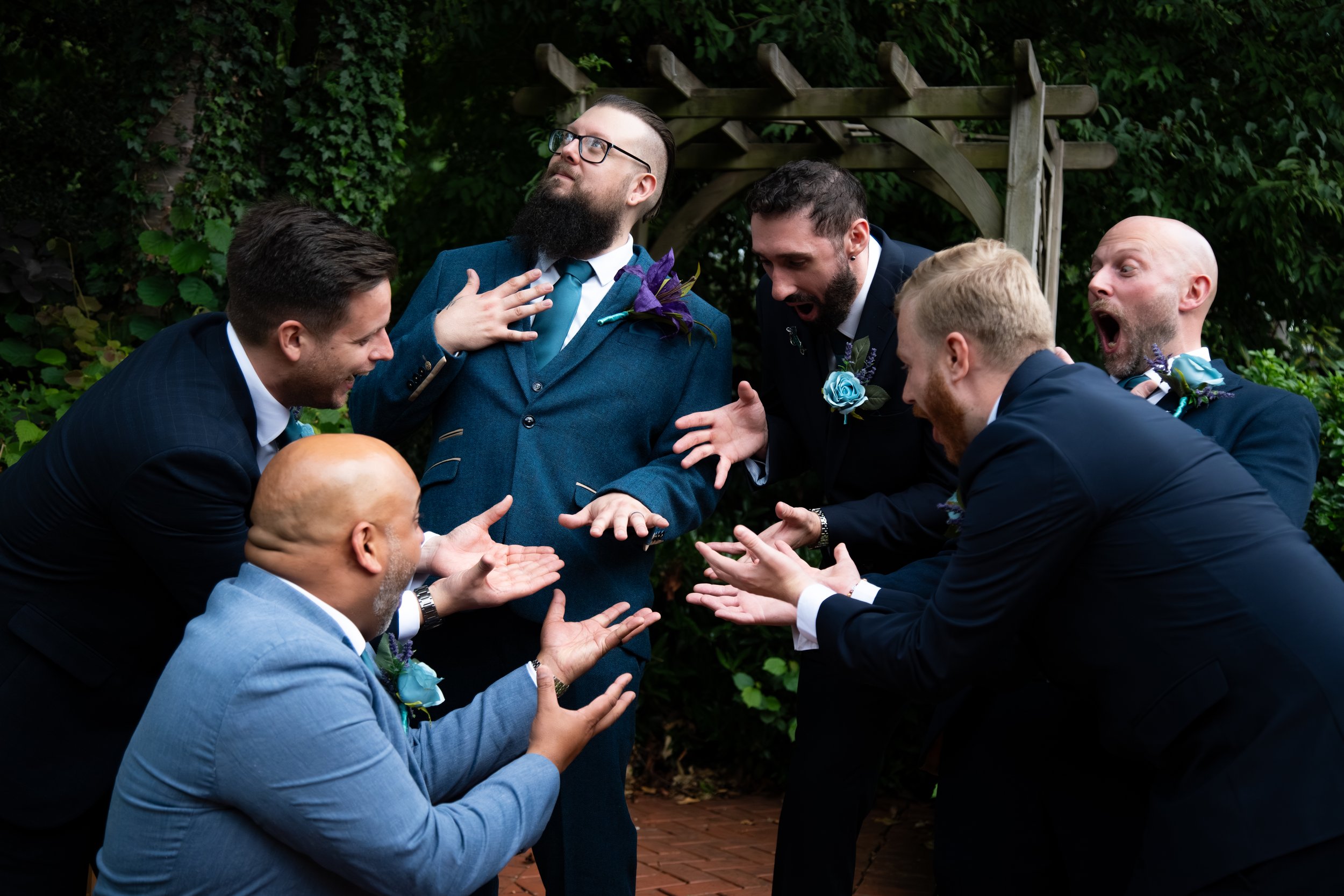 Groom and Groomsmen posed, at The village, Hyde