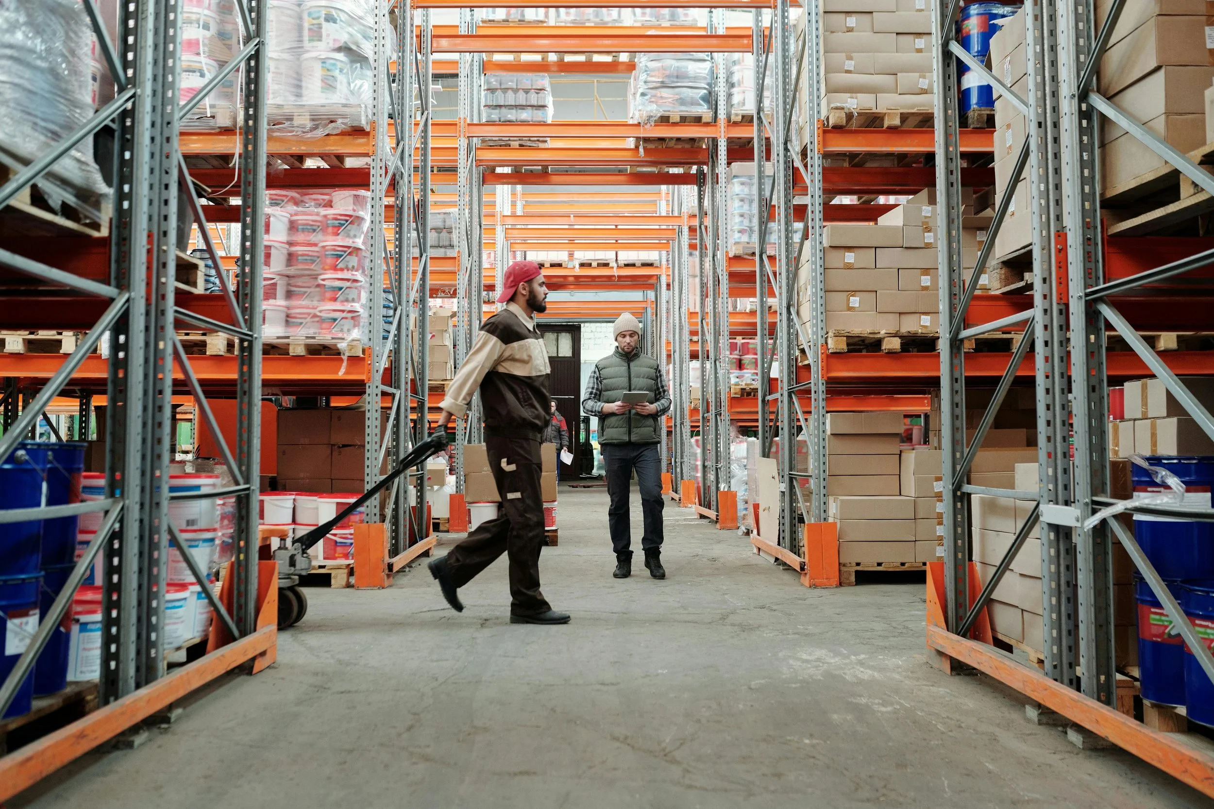 Warehouse employee working with equipment, reflecting occupational safety and coverage