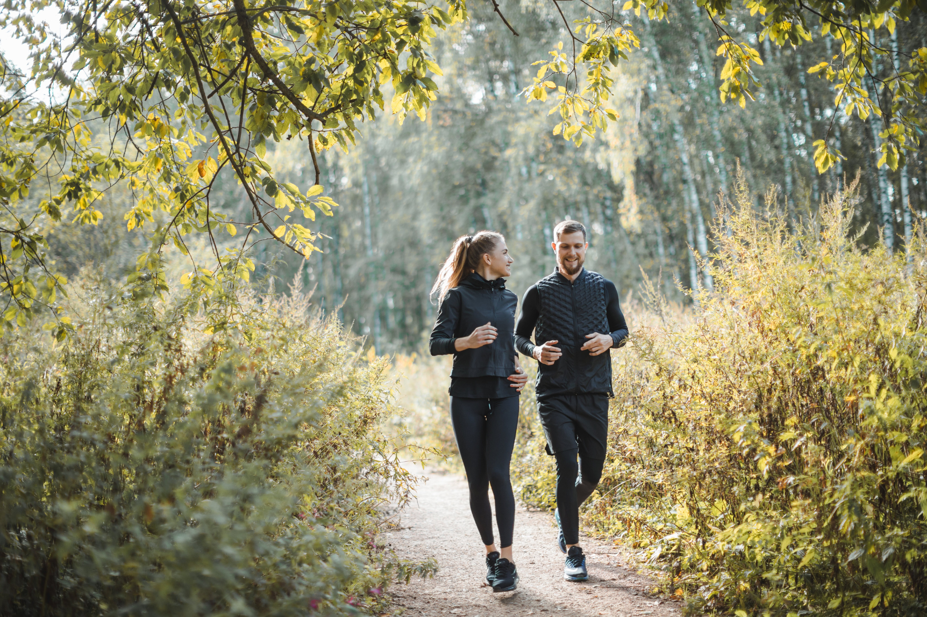 Active couple exercising together, reflecting wellbeing and financial protection for their future