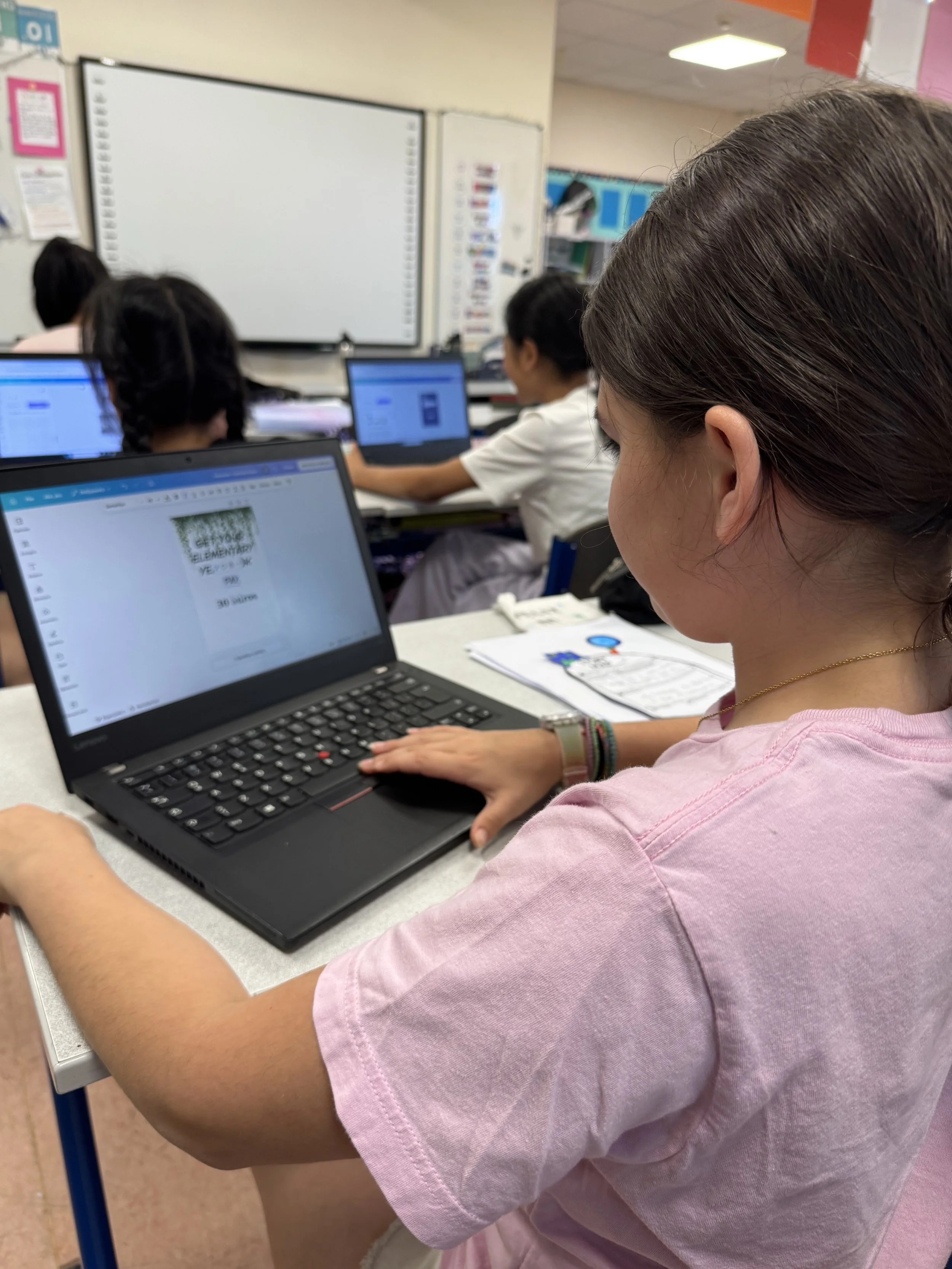 Students working during a Graphic Design Club meeting