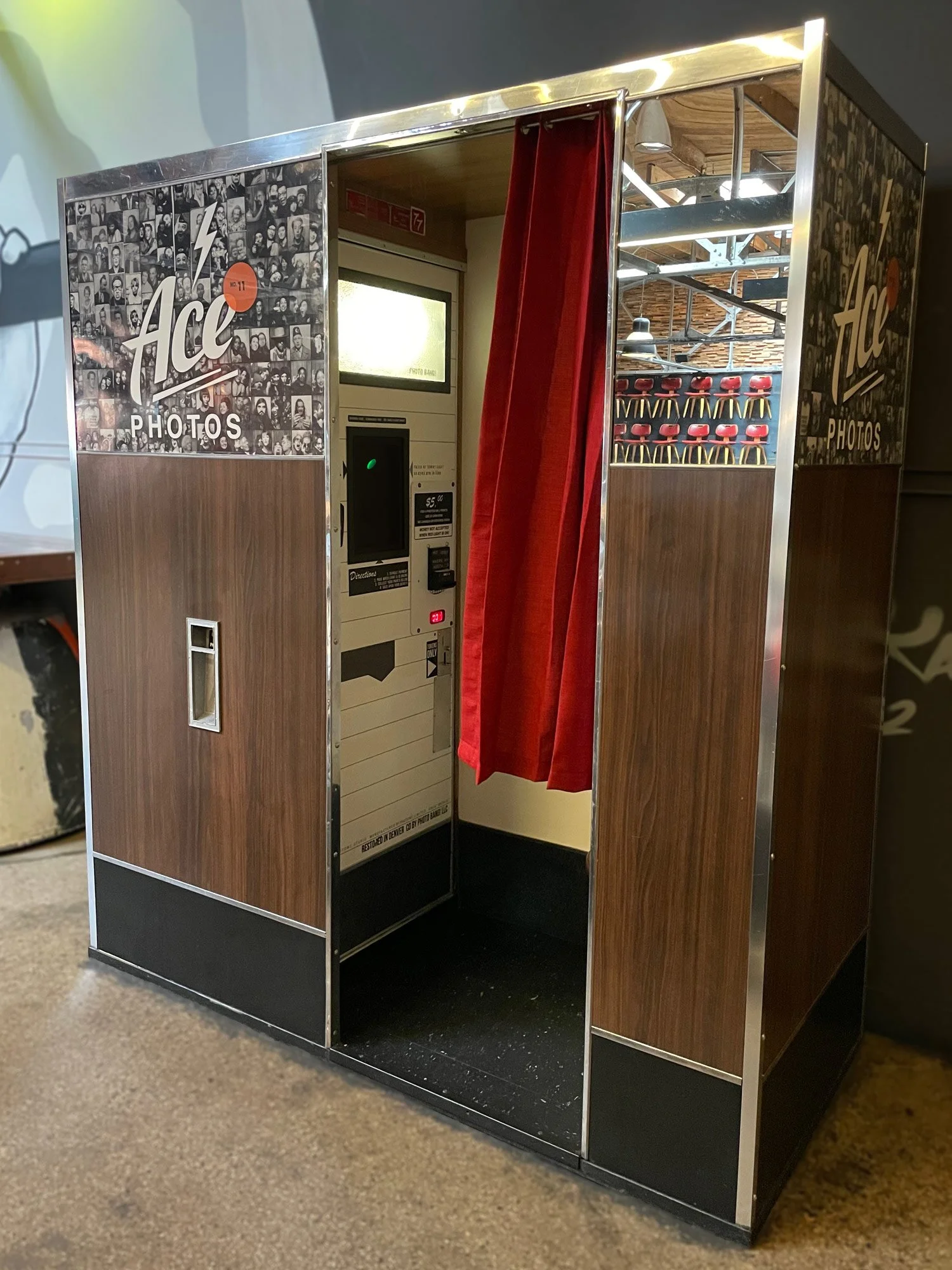 Photo-Me Model 17 photo booth with a wooden and metal exterior, red curtain.