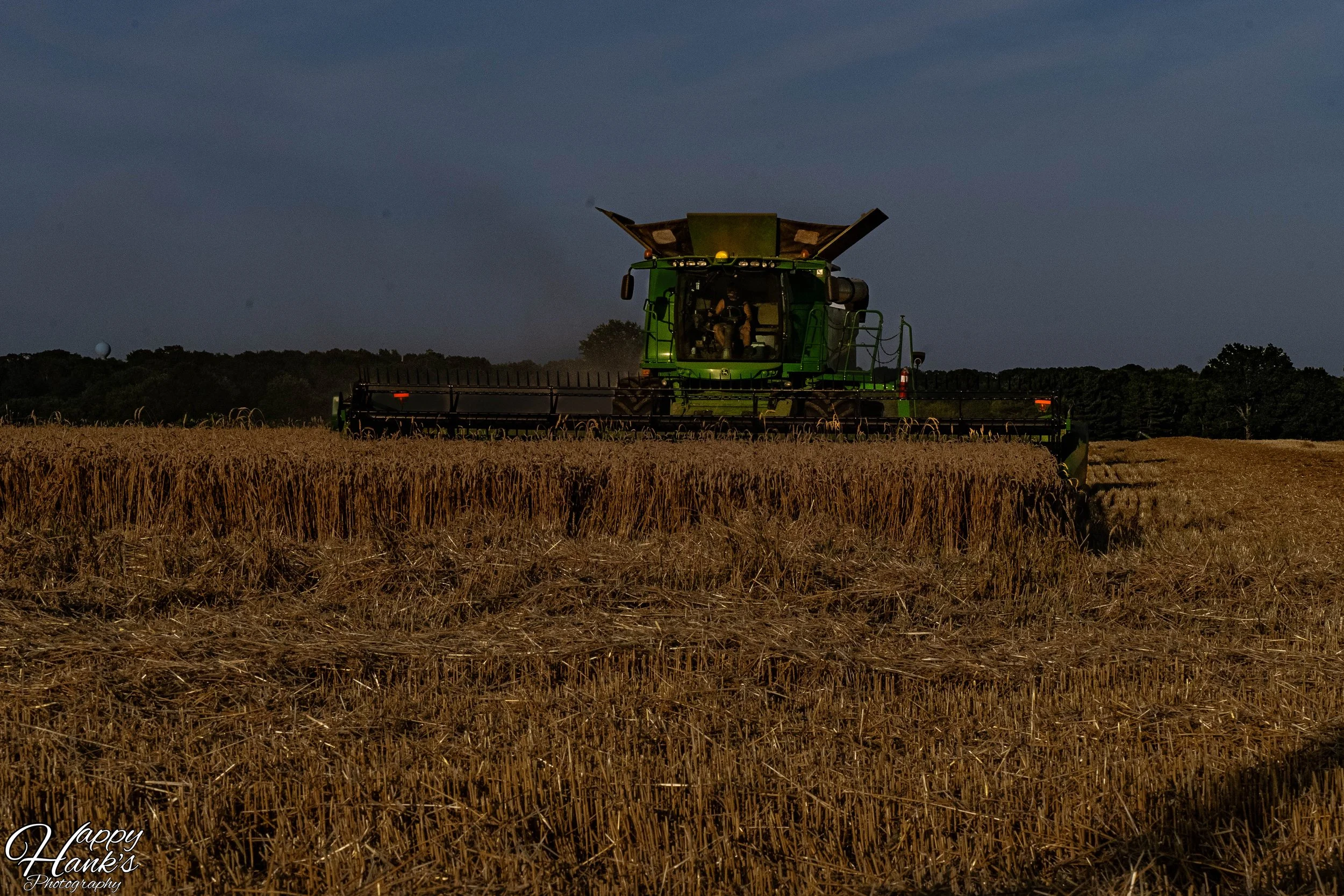 JOHN DEERE HARVESTING WHEAT