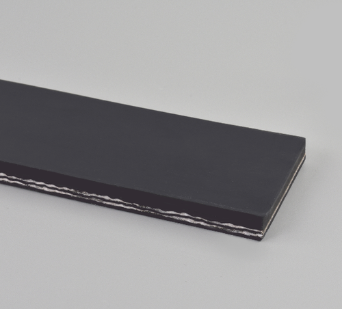 A close-up view of a black conveyor belt with layered fabric and rubber construction on a light background.