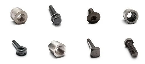 A collection of eight different screws and bolts of various sizes and types arranged in two rows.