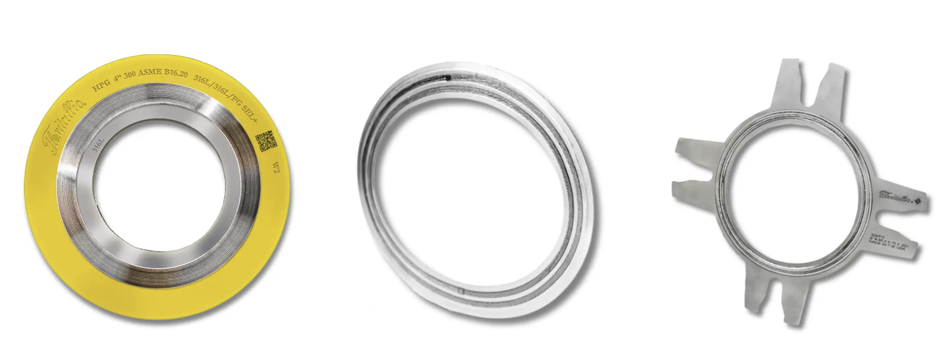 Three metallic mechanical seals of different designs and sizes displayed against a white background.