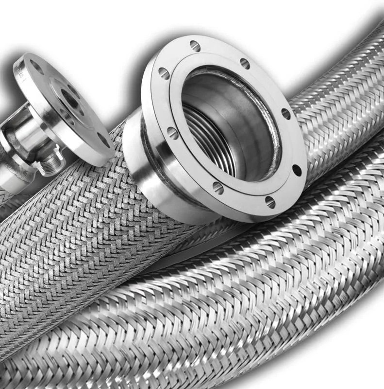 Close-up of industrial metal braided hoses with flange fittings.