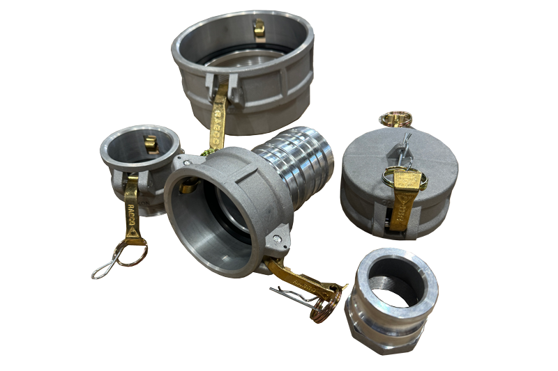 Set of industrial pipe fittings, including couplings, adapters, and caps, made of metal with some attached gold-colored safety tags.