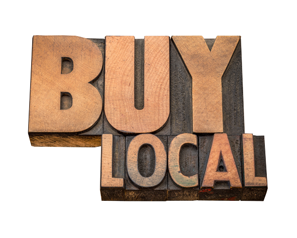 Wooden block letters spelling out 'BUY LOCAL'.