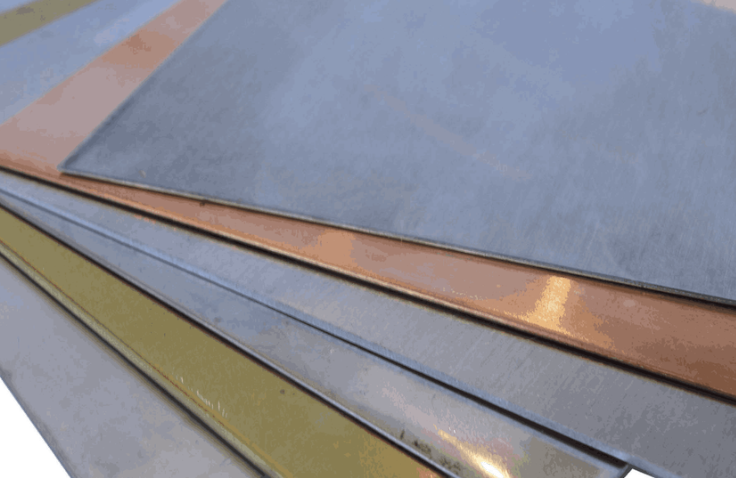 A close-up view of several metal sheets in different colors, stacked on top of each other.