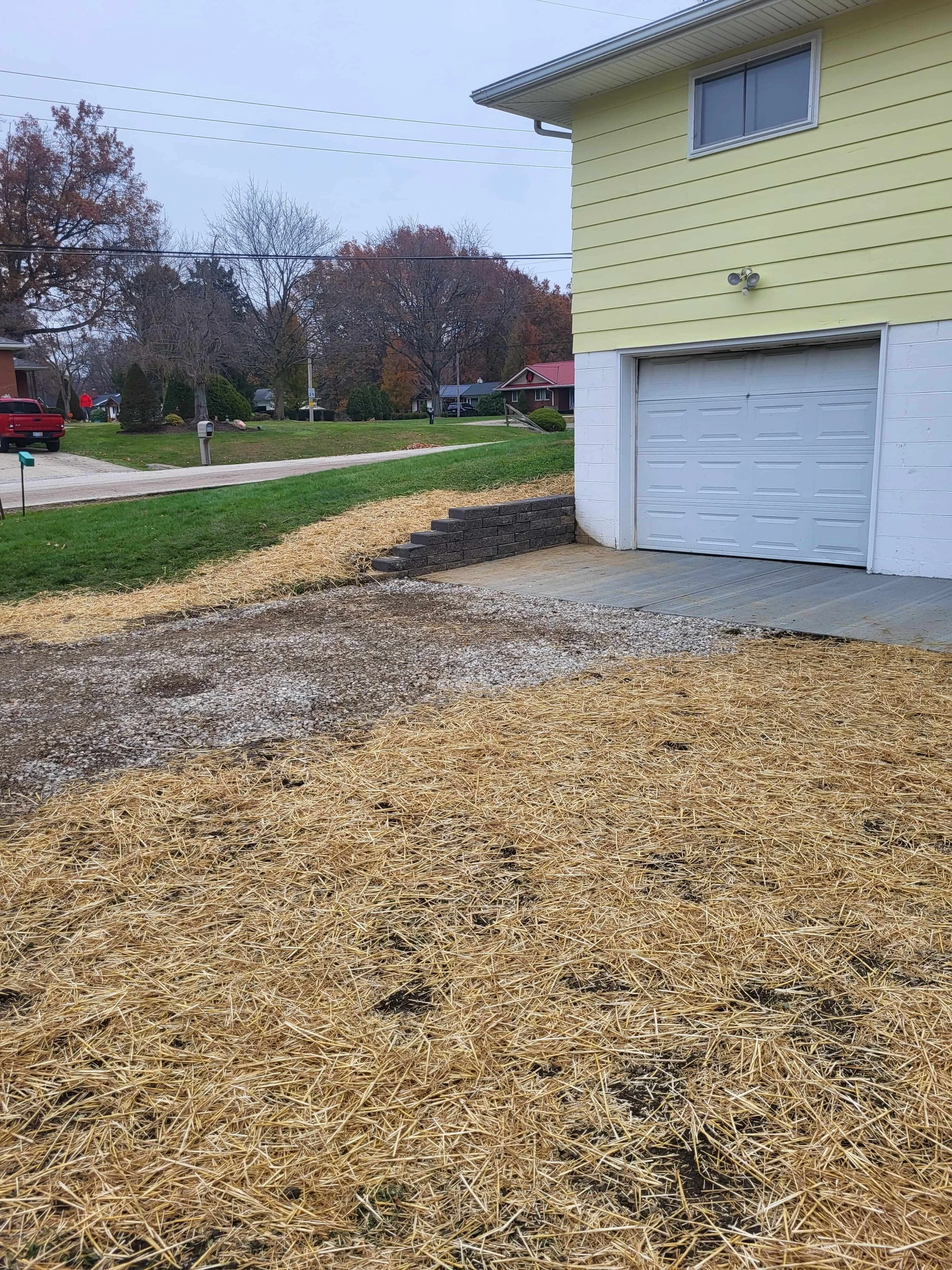 Concrete rear patio replacement and solid block retaining walls by DLR Construction in Cuyahoga Falls.