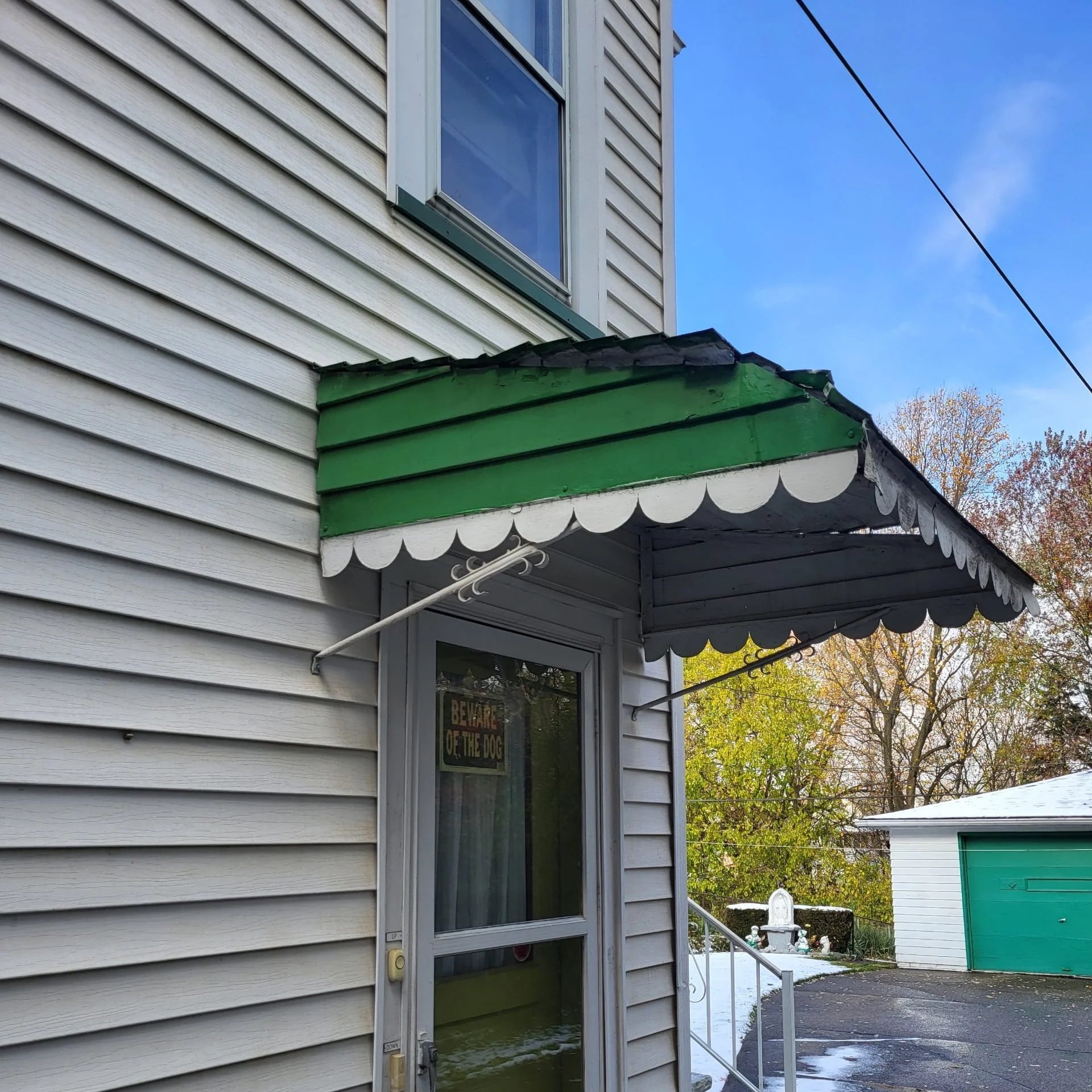 Damaged Metal Awning Above Side Entrance – Before Replacement