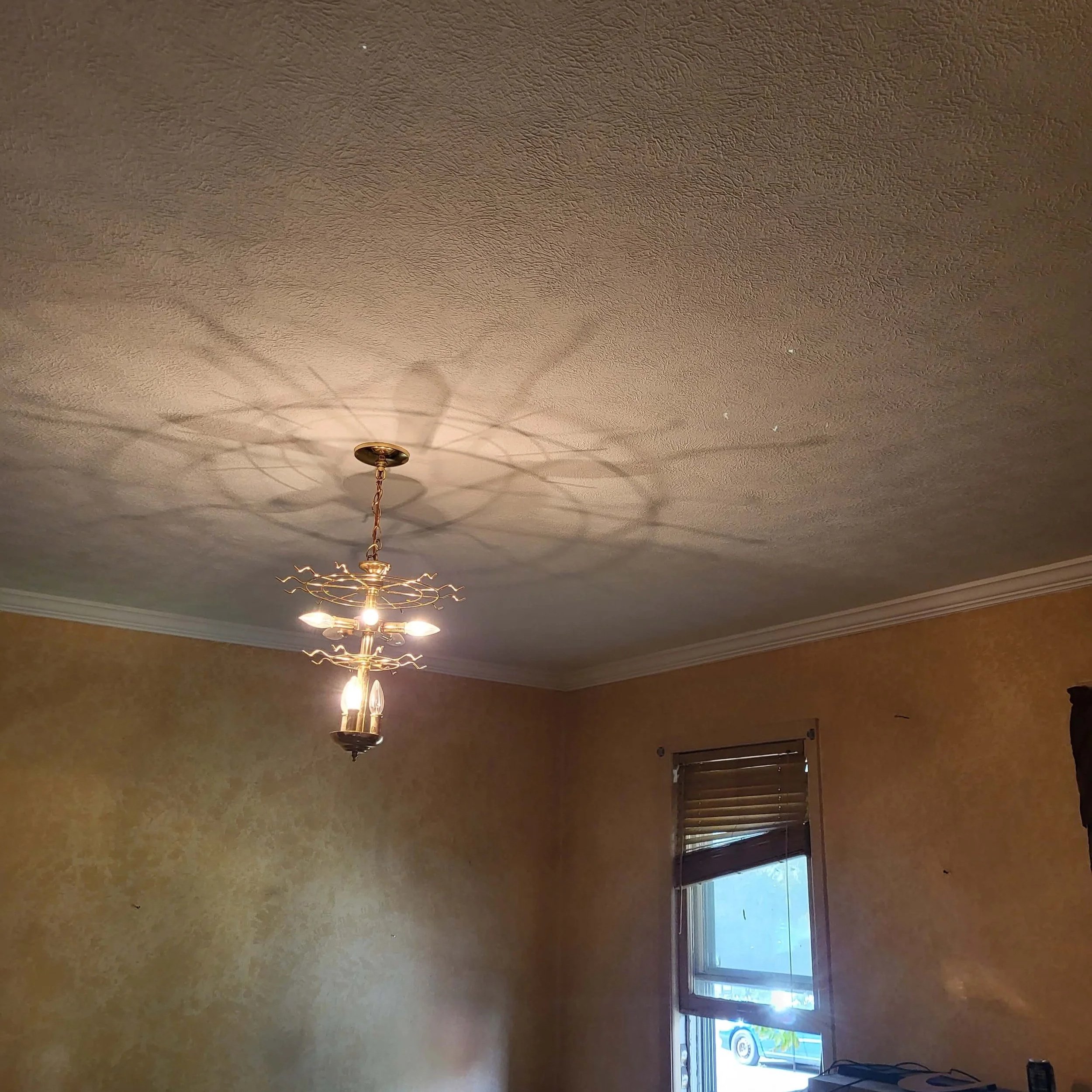 Repaired Living Room Ceiling After Water Damage Restoration