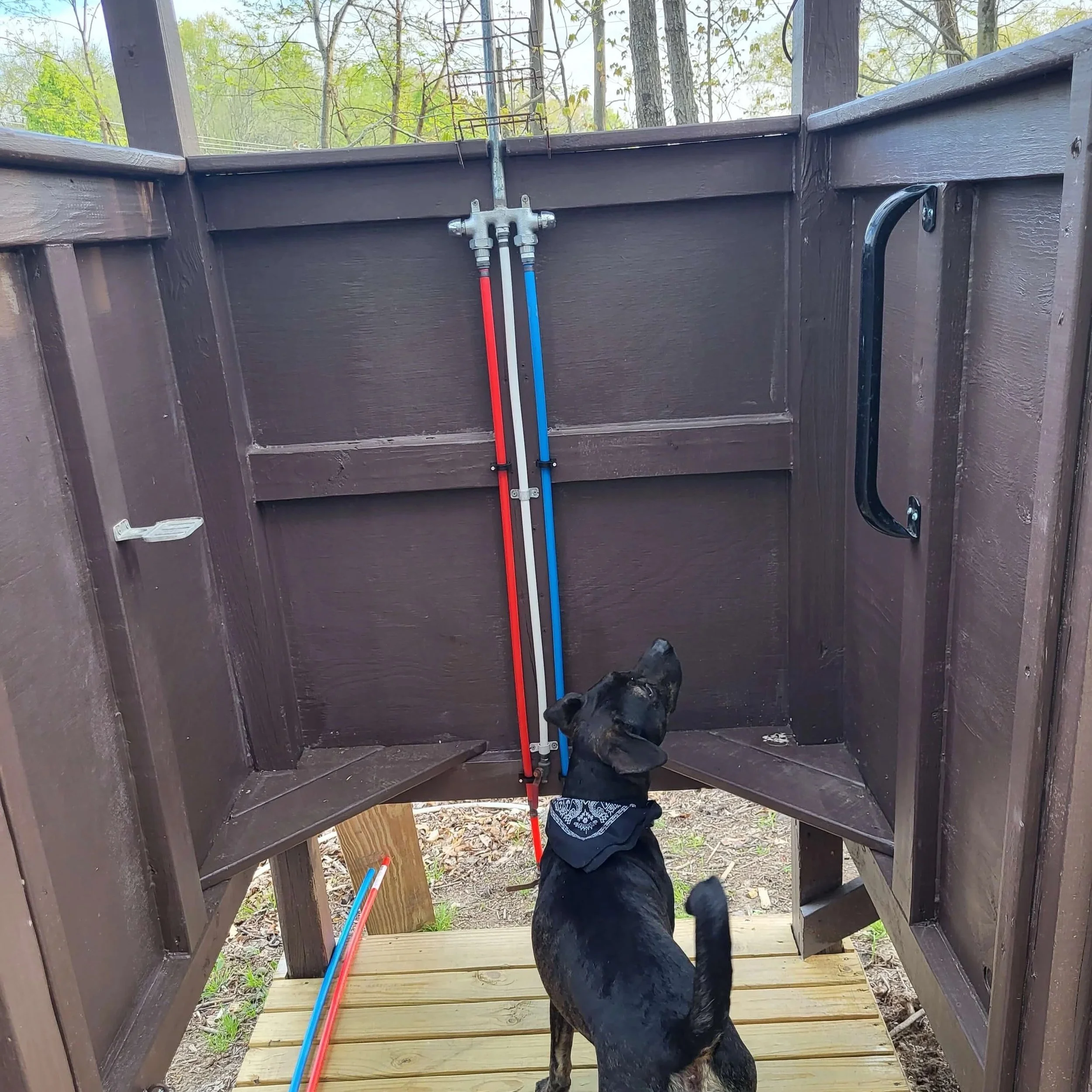 Outdoor Shower Interior with Water Lines and Treated Lumber