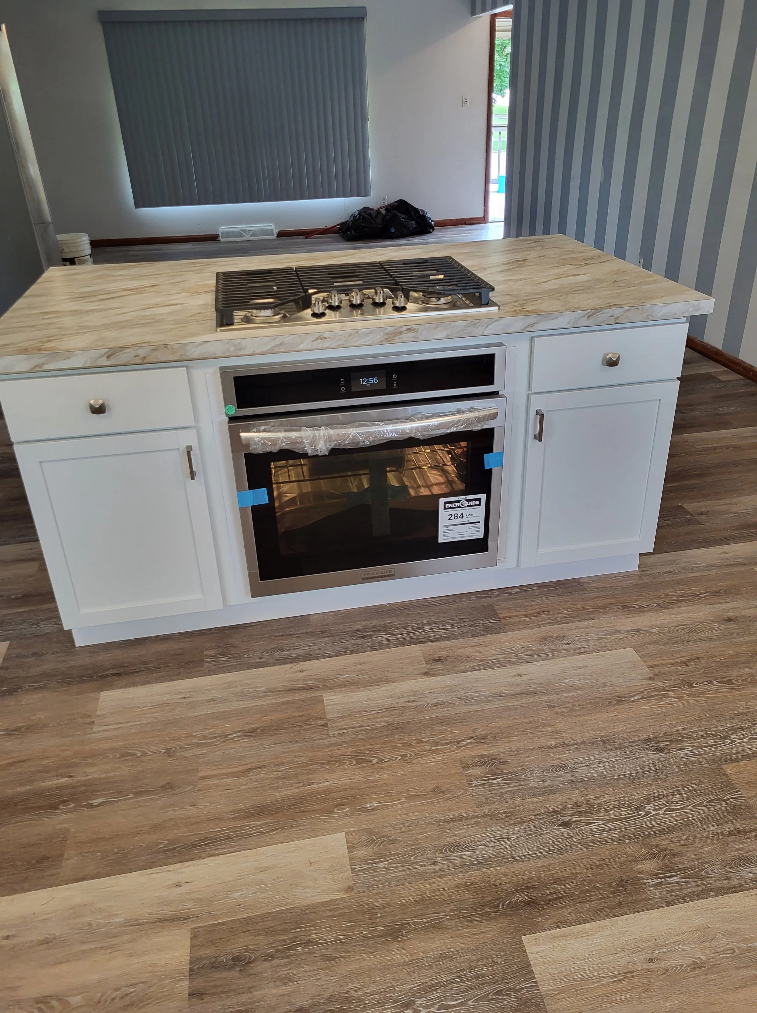 Custom Island with Drop In Oven And Stove top with 5 burners. Kitchen Open Concept preview.