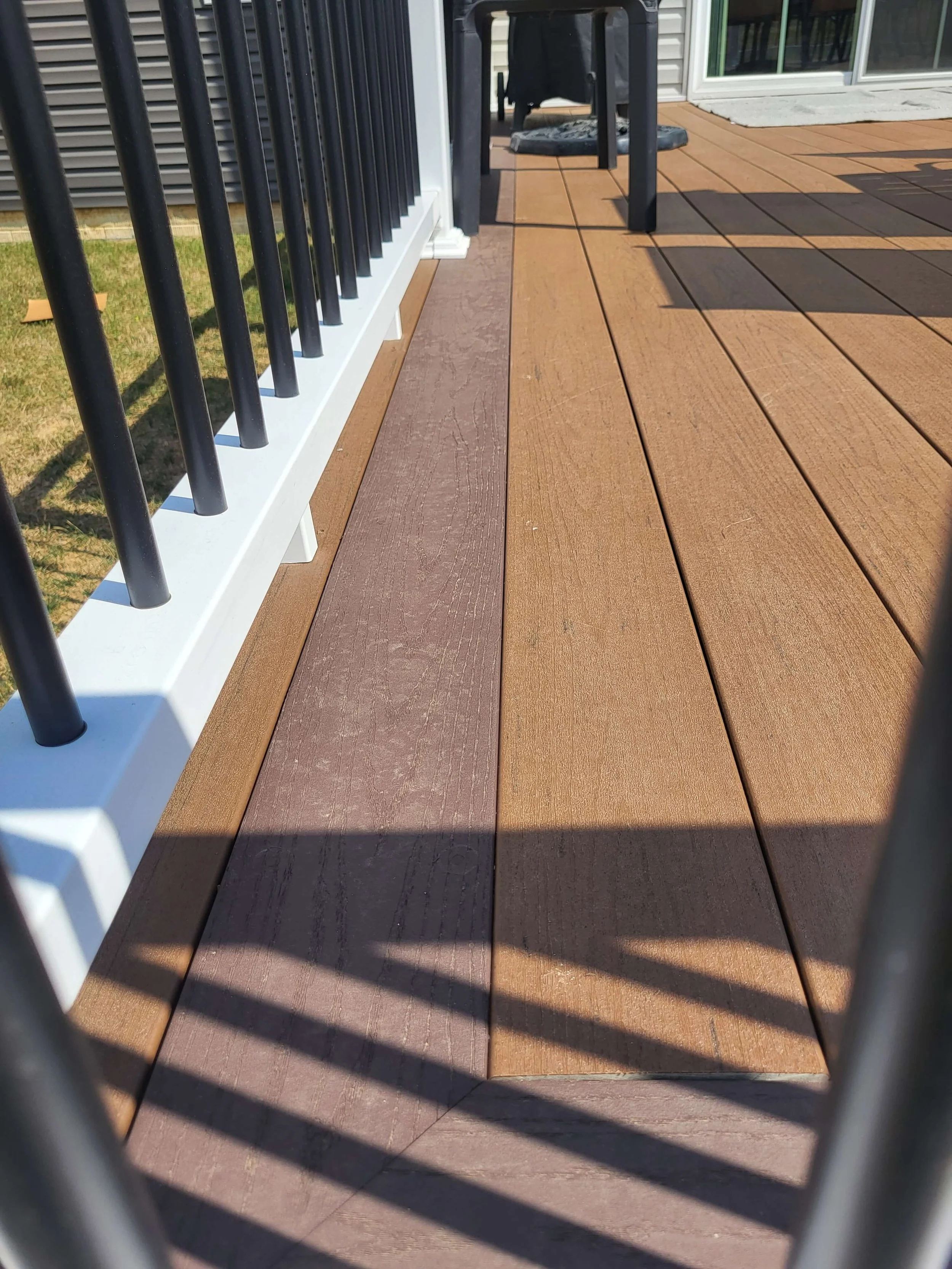 DLR Construction custom deck building in Northeast Ohio showcasing perimeter boards and Vinyl handrails.