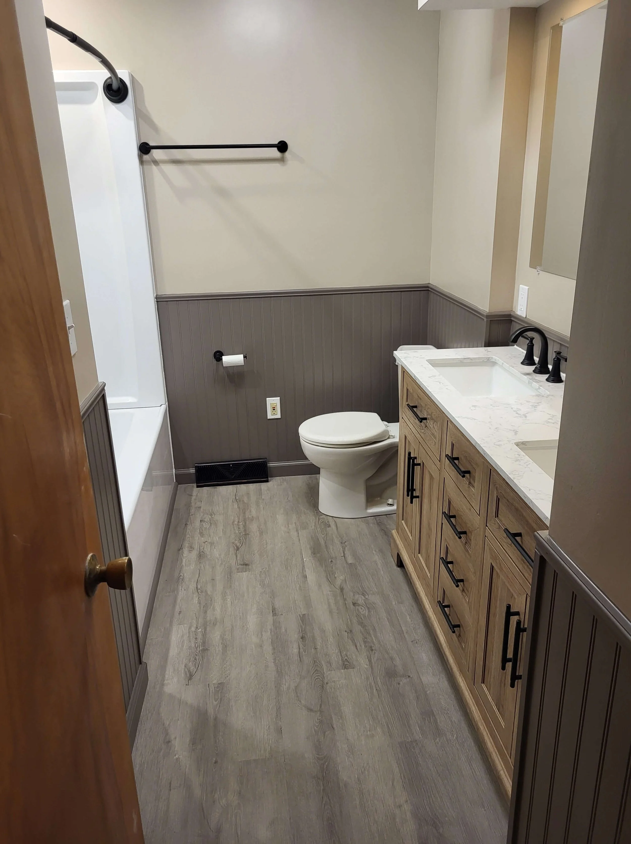 DLR Construction bathroom renovation featuring a modern double-sink vanity, and bead-board in Cleveland Ohio