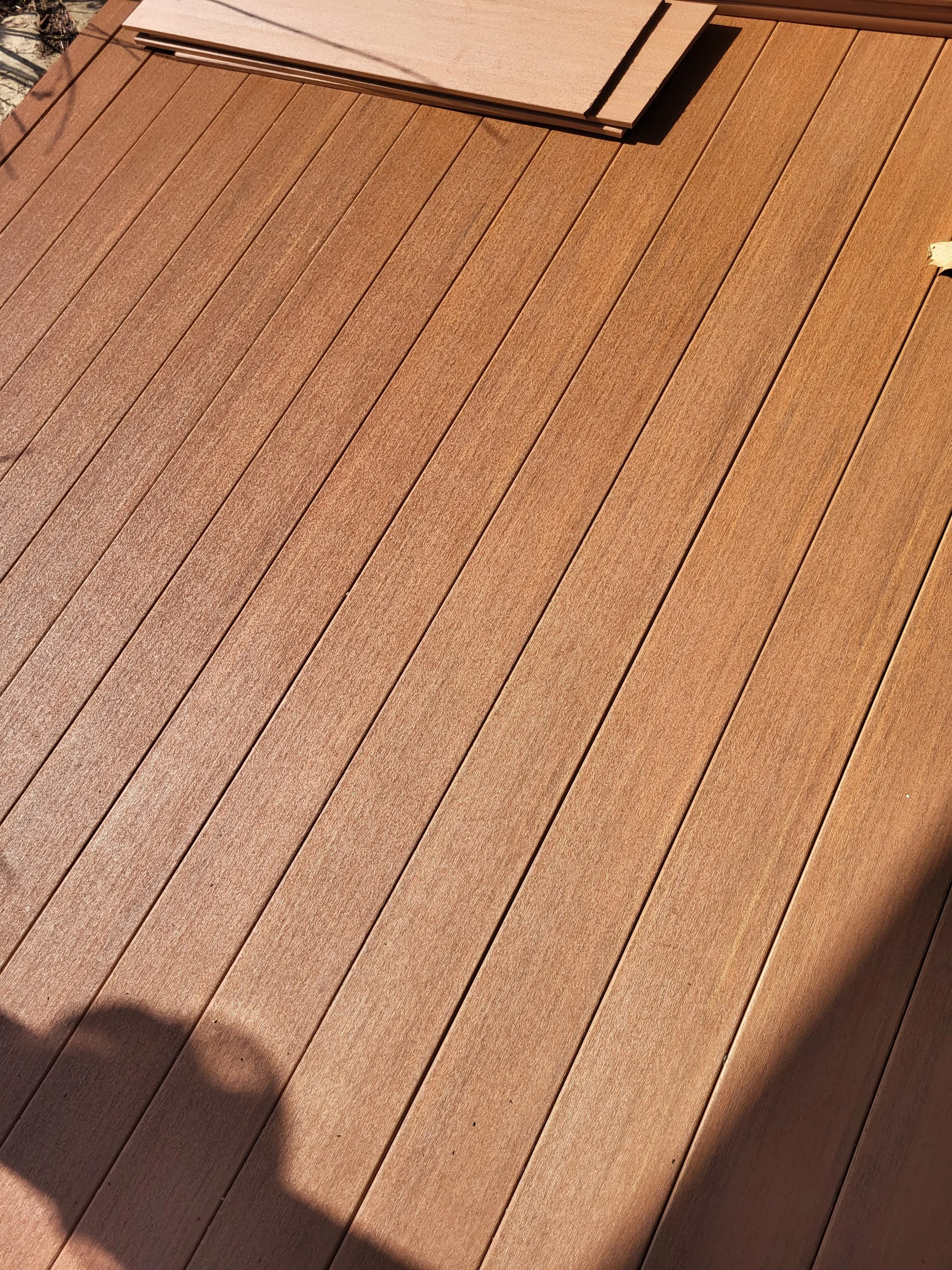 New composite deck boards installed at a front entrance in Northeast Ohio with a low-maintenance finish.