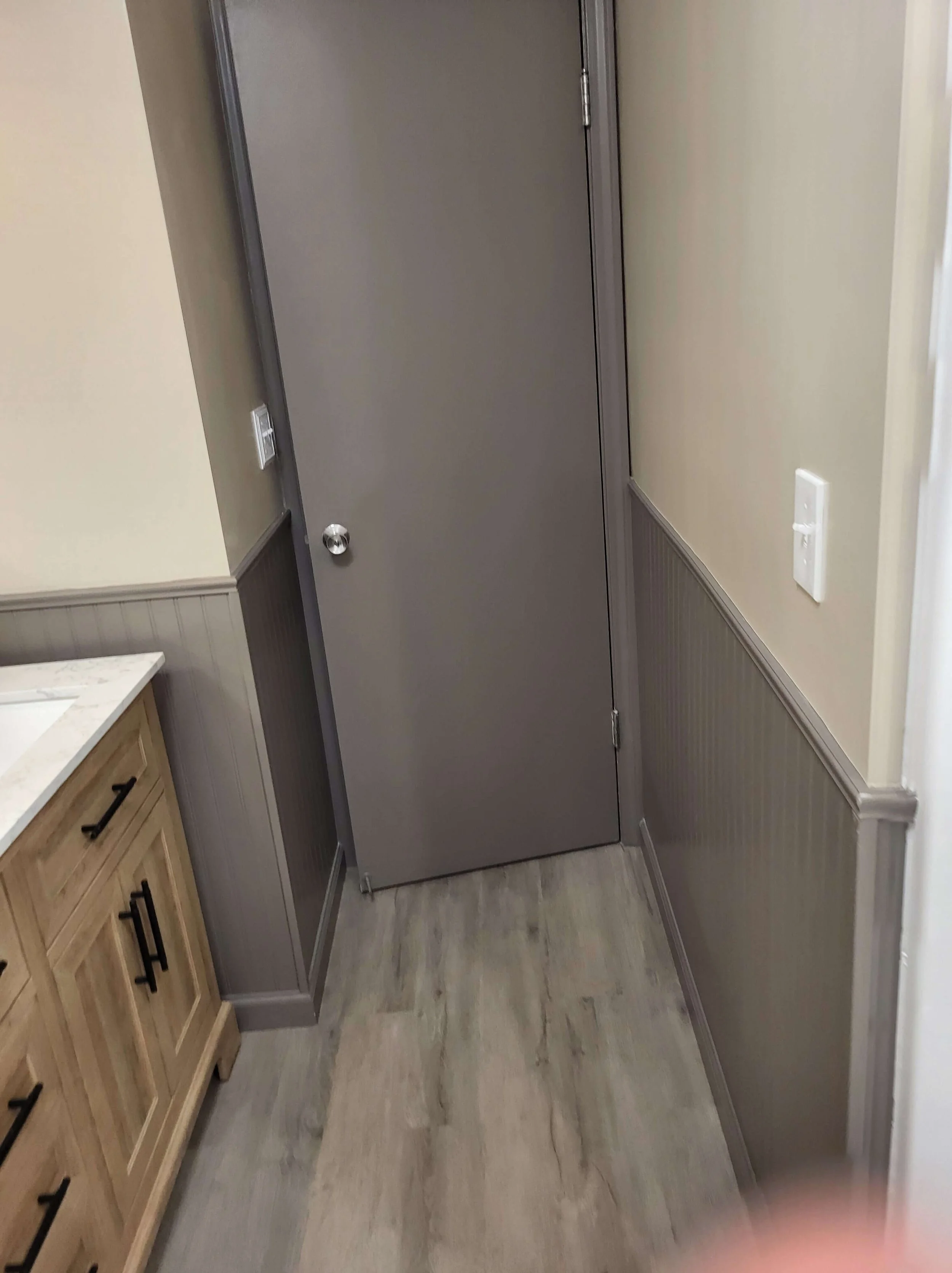 Finished bathroom vanity with beadboard detail in Northeast Ohio renovation