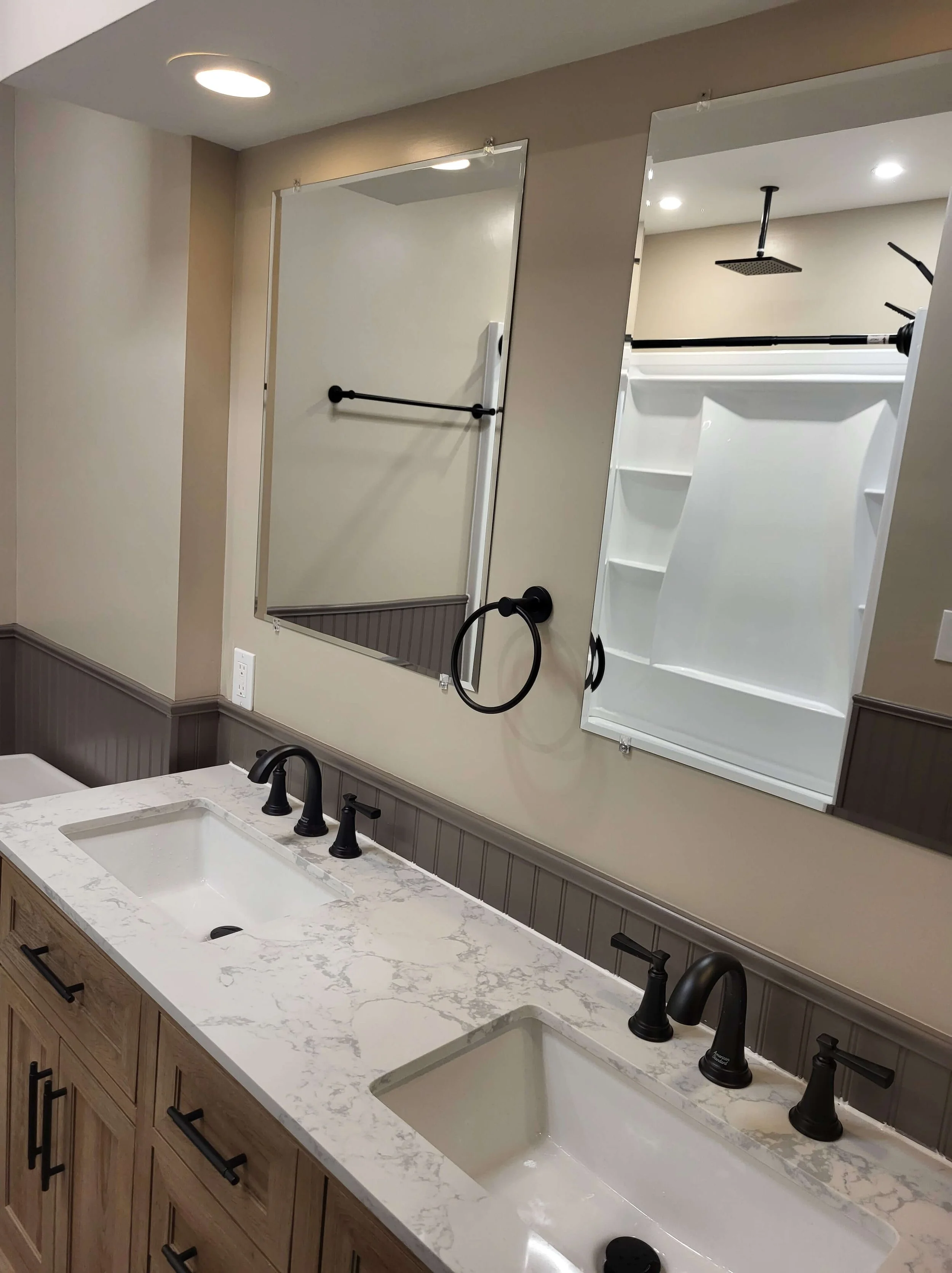 Custom double vanity with mirror in finished Northeast Ohio bathroom renovation
