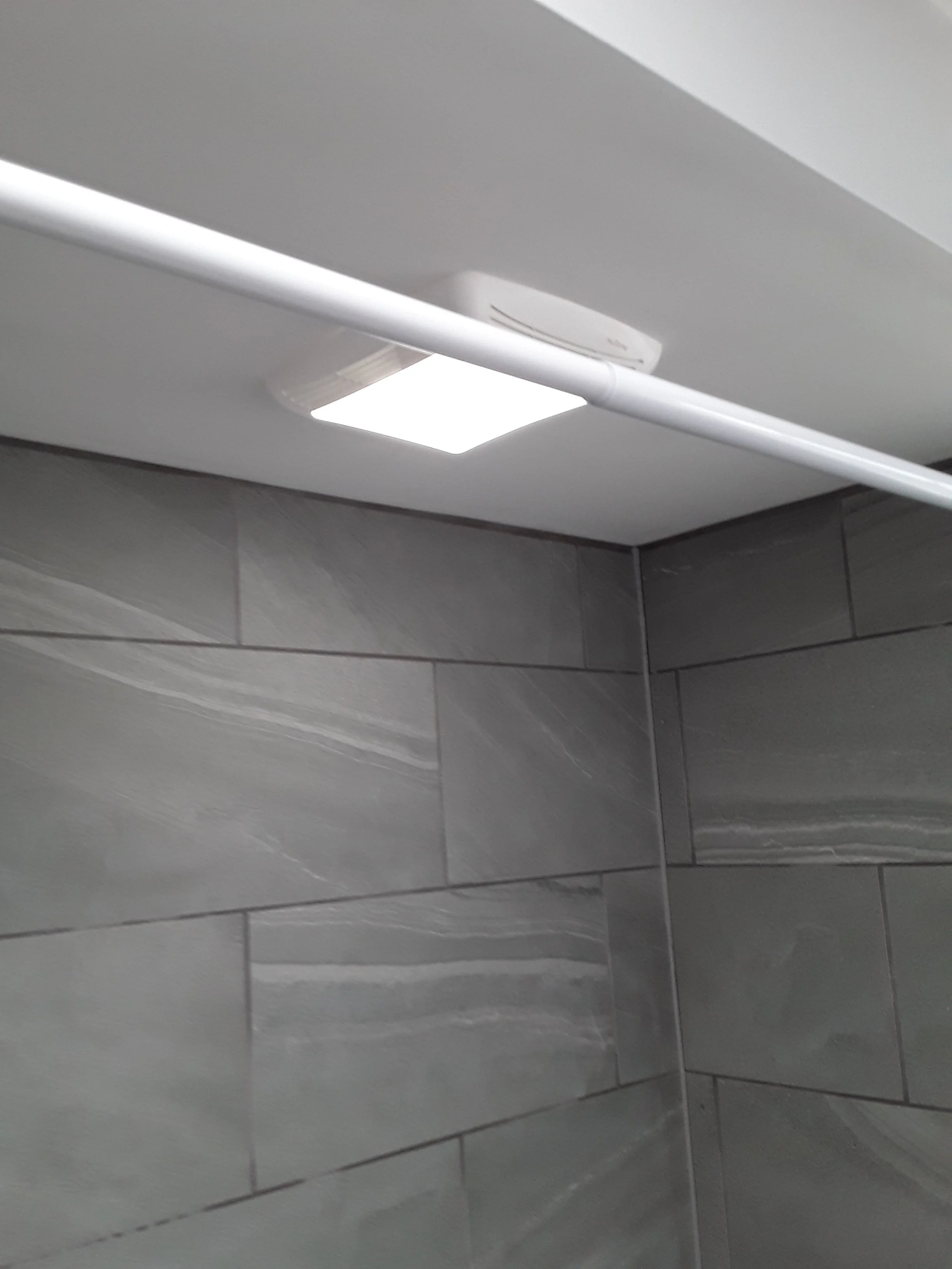 new exhaust fan, improving lighting and bathroom ventilation.