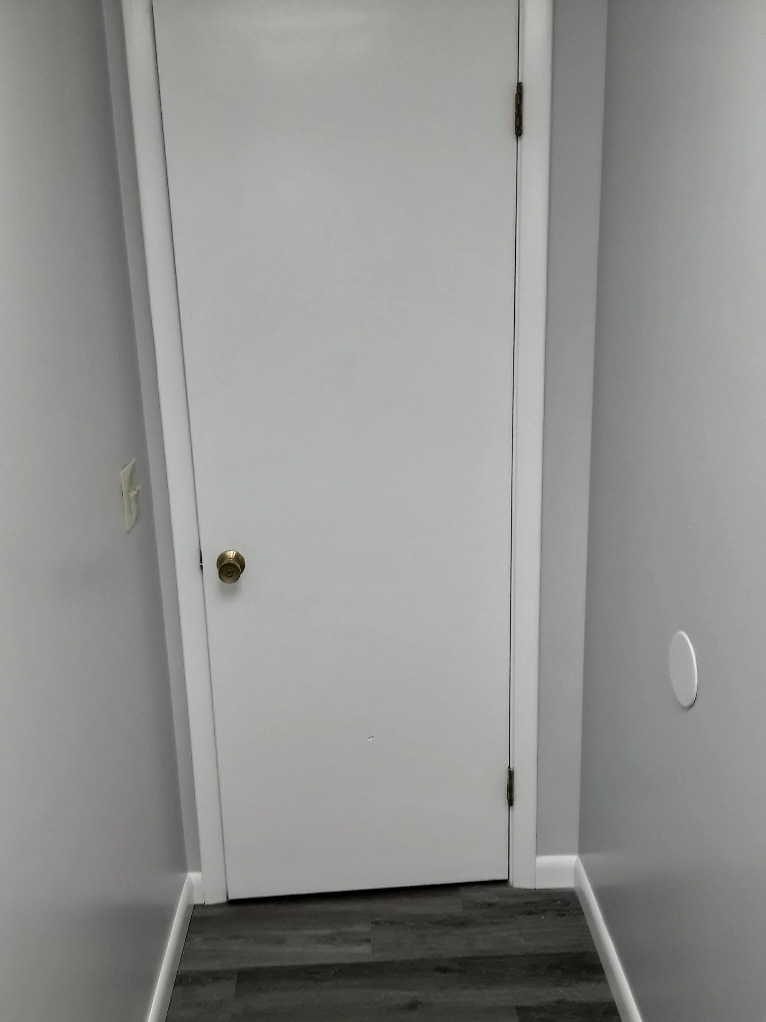 Newly painted bathroom door with fresh trim and smooth finish