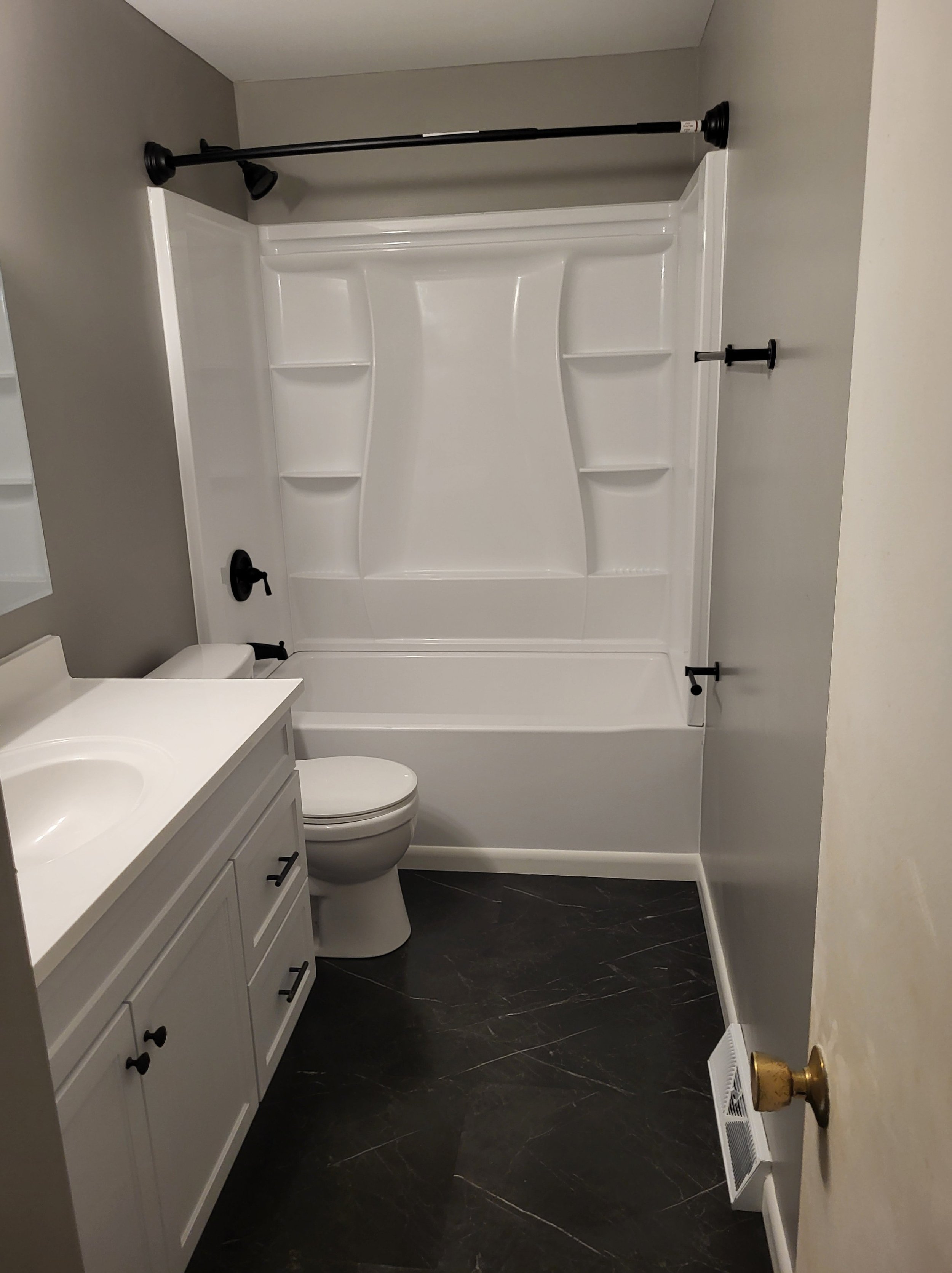 Bathroom Renovation by DLR. New Shower and tub installation, Tile Flooring, Drywalling and Painting, Carpentry Services