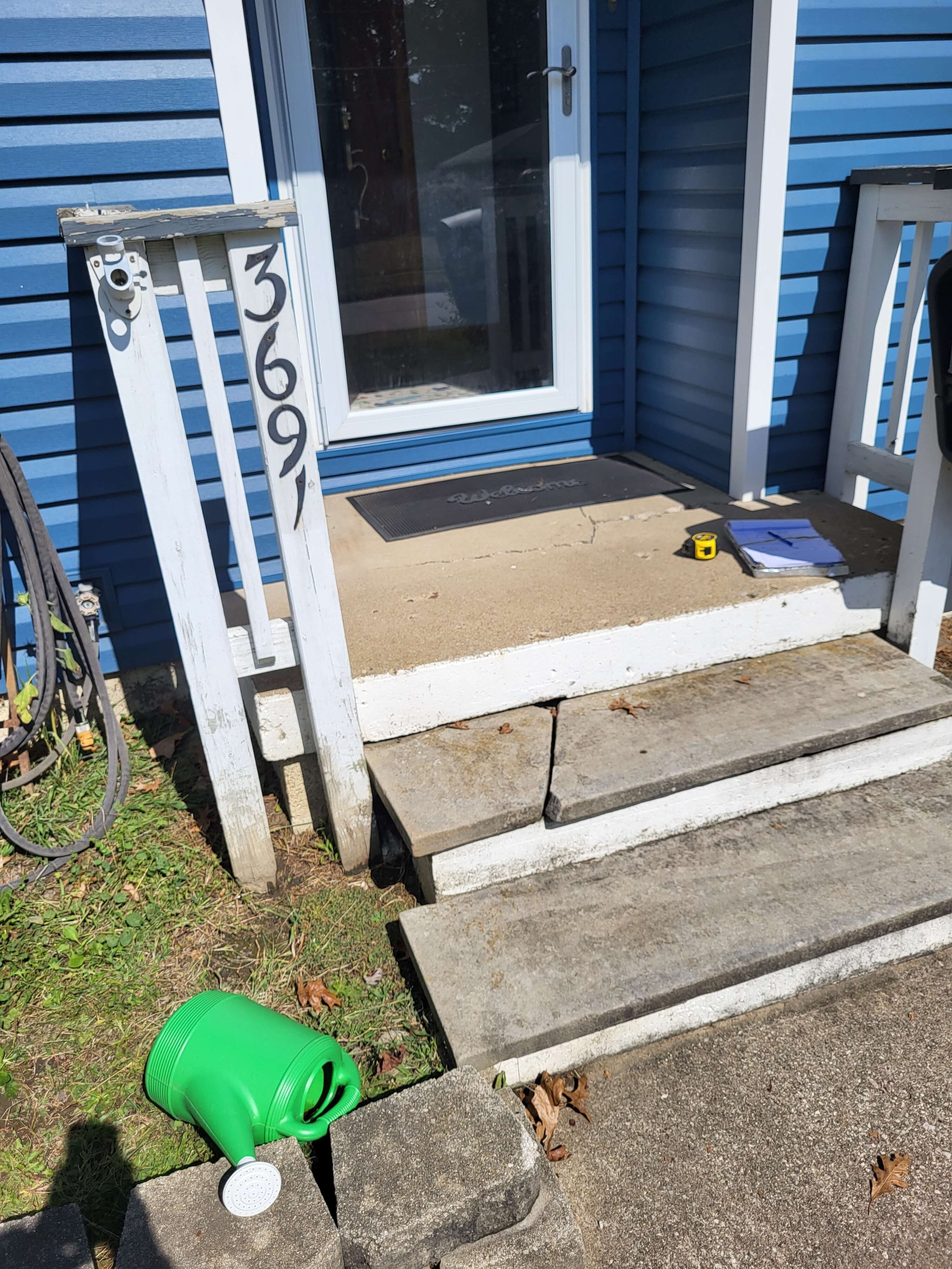 old damaged front entry stairs and sidewalk before deck replacement in Akron Ohio