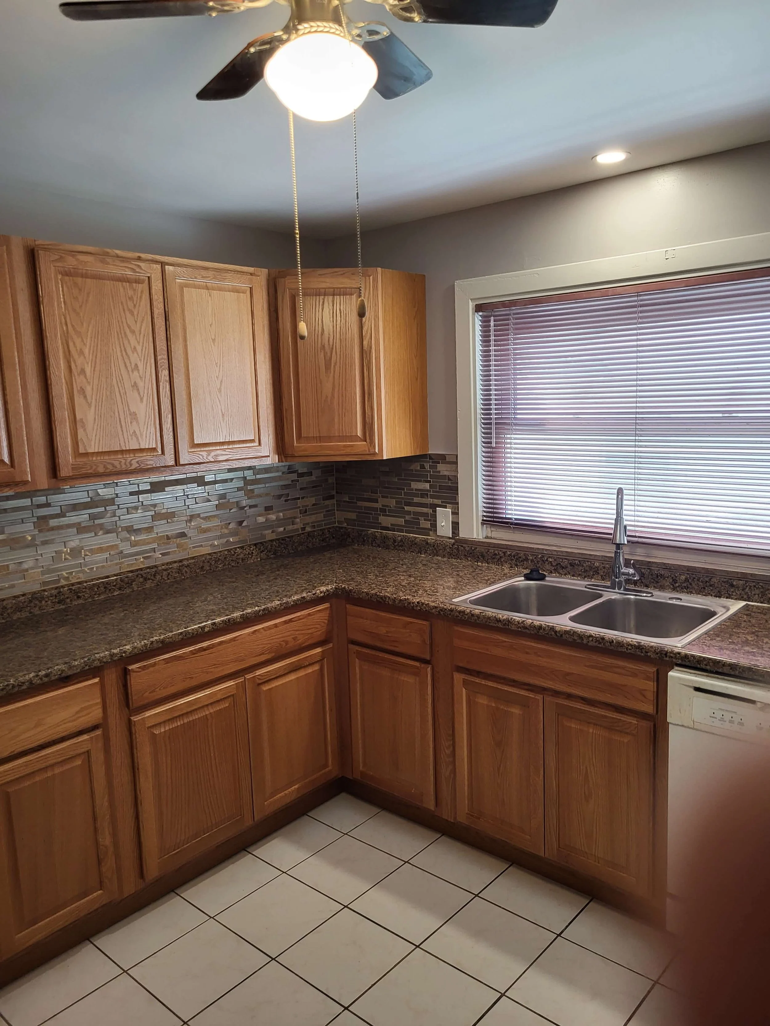 Smart kitchen remodeling with custom backsplash and recessed lighting by DLR Construction in Cuyahoga Falls, Ohio.