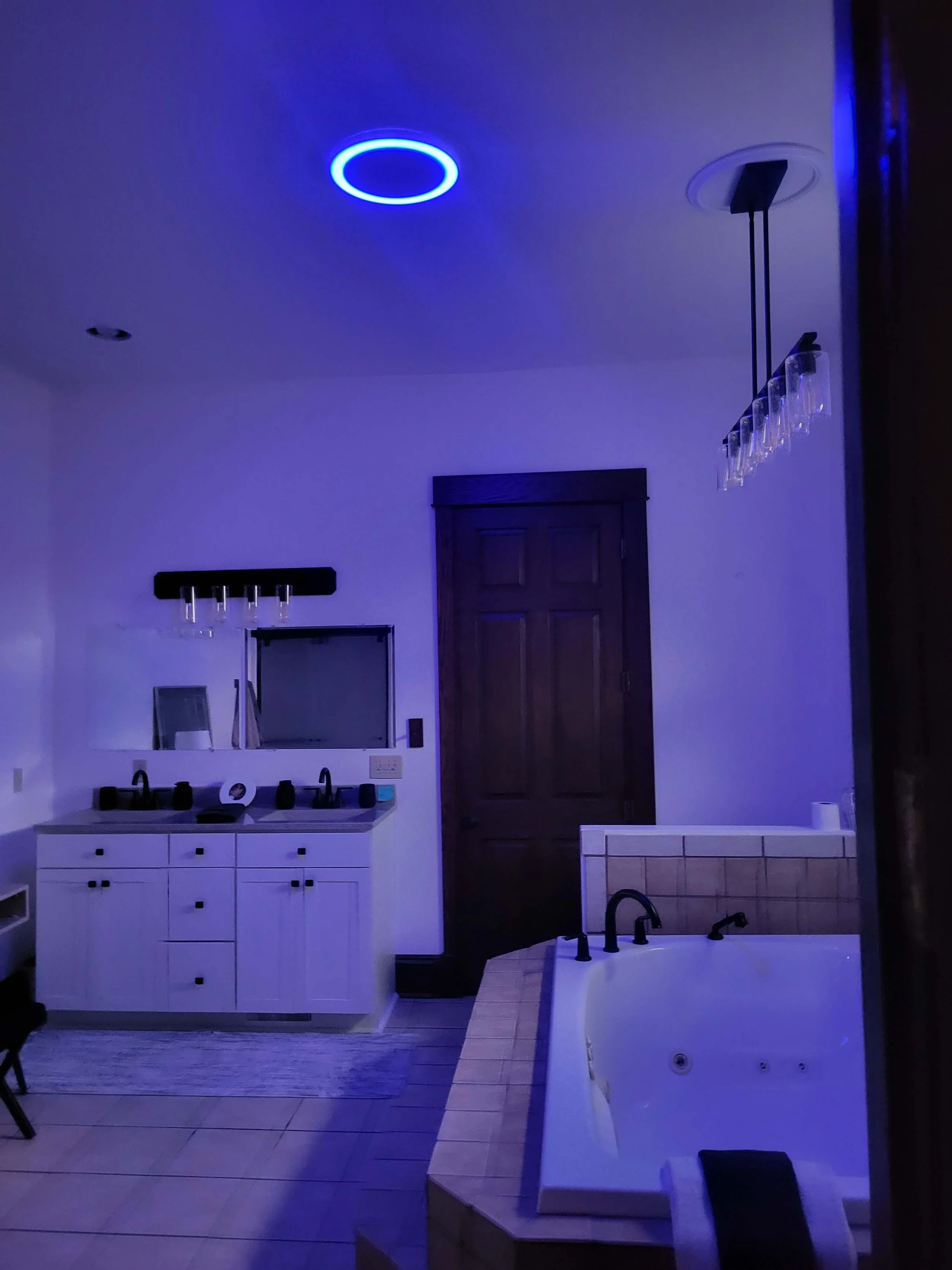 Modern bathroom with LED accent lighting creating a spa-like atmosphere in a Northeast Ohio remodel