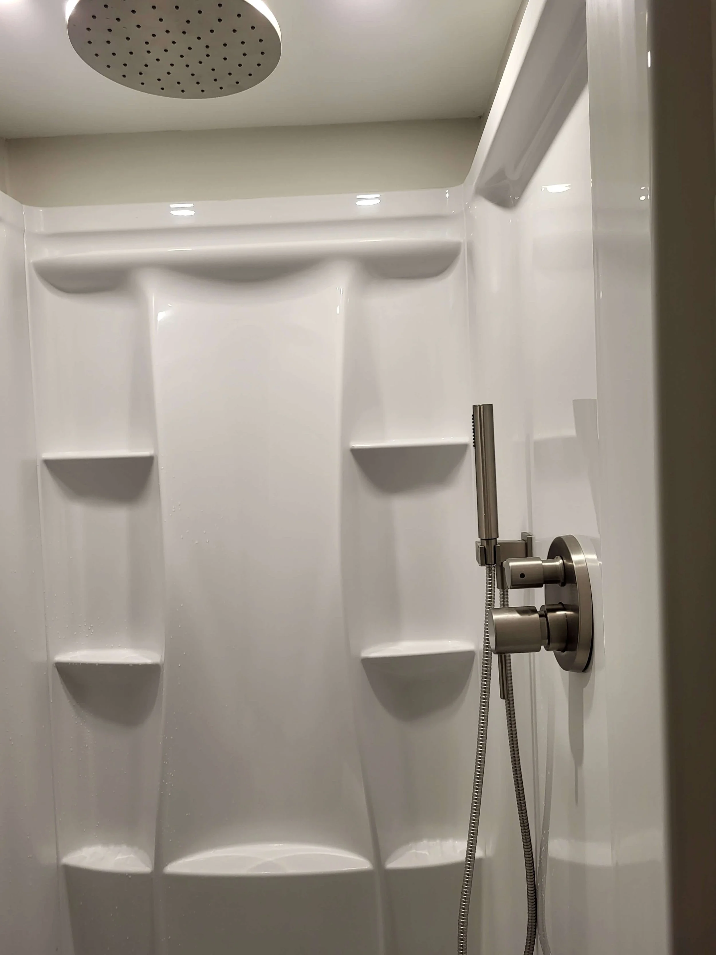 Installed basement shower unit in full bathroom build