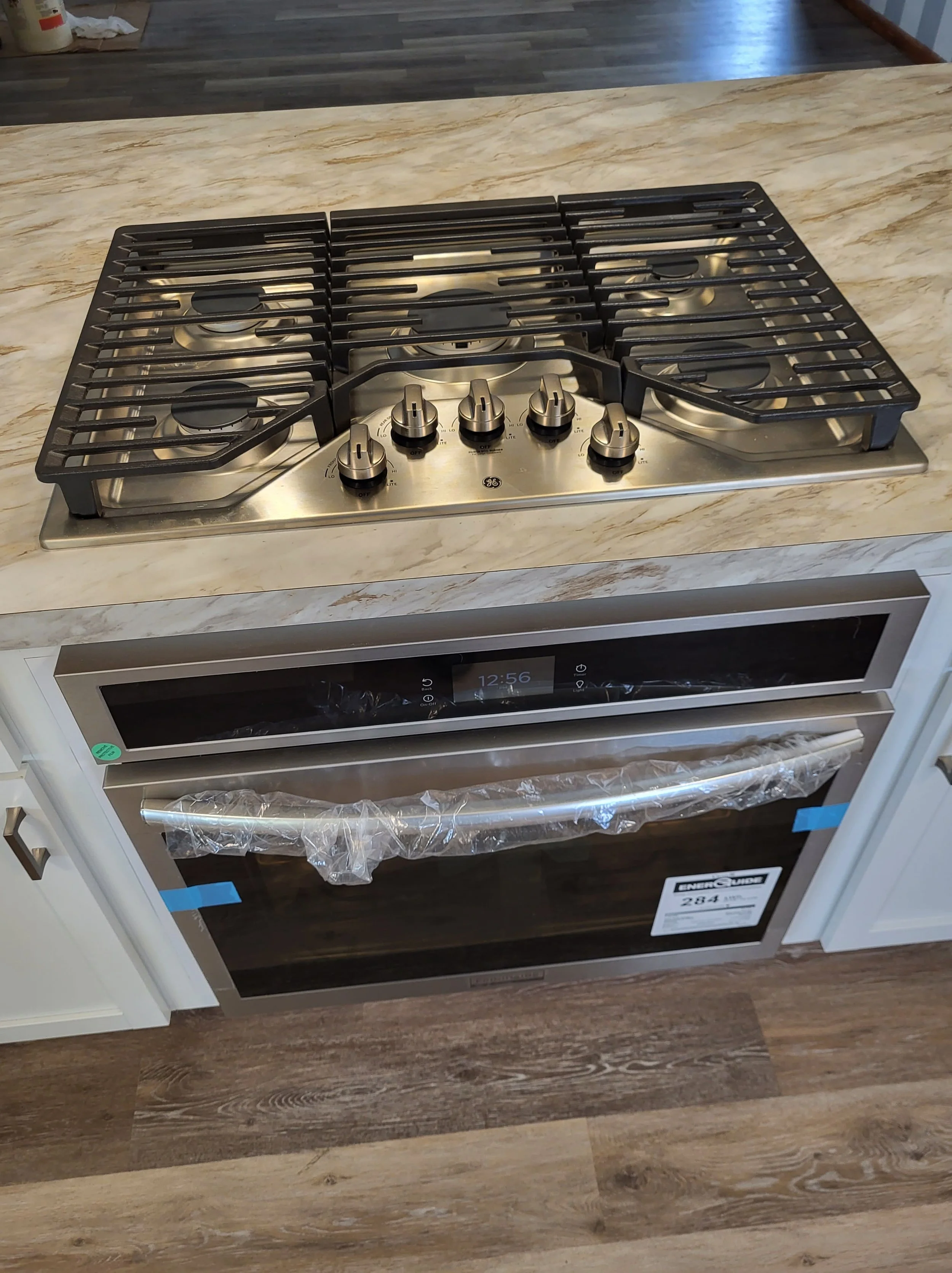 Drop-in Oven With Cooktop in Custom Built Island By DLR Construction.
