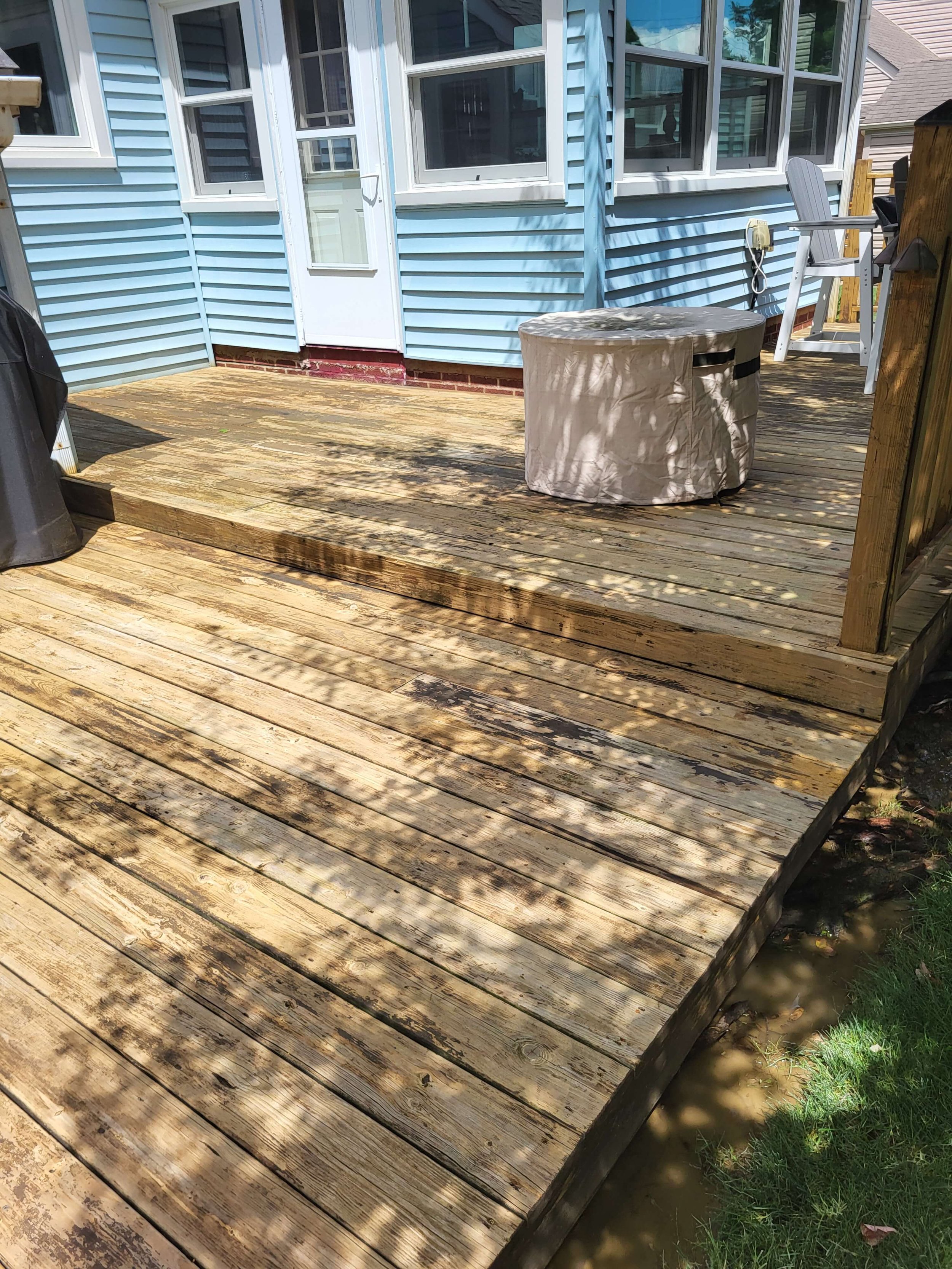 Deep wood deck pressure washing and surface preparation completed by DLR Construction in Hudson OH.