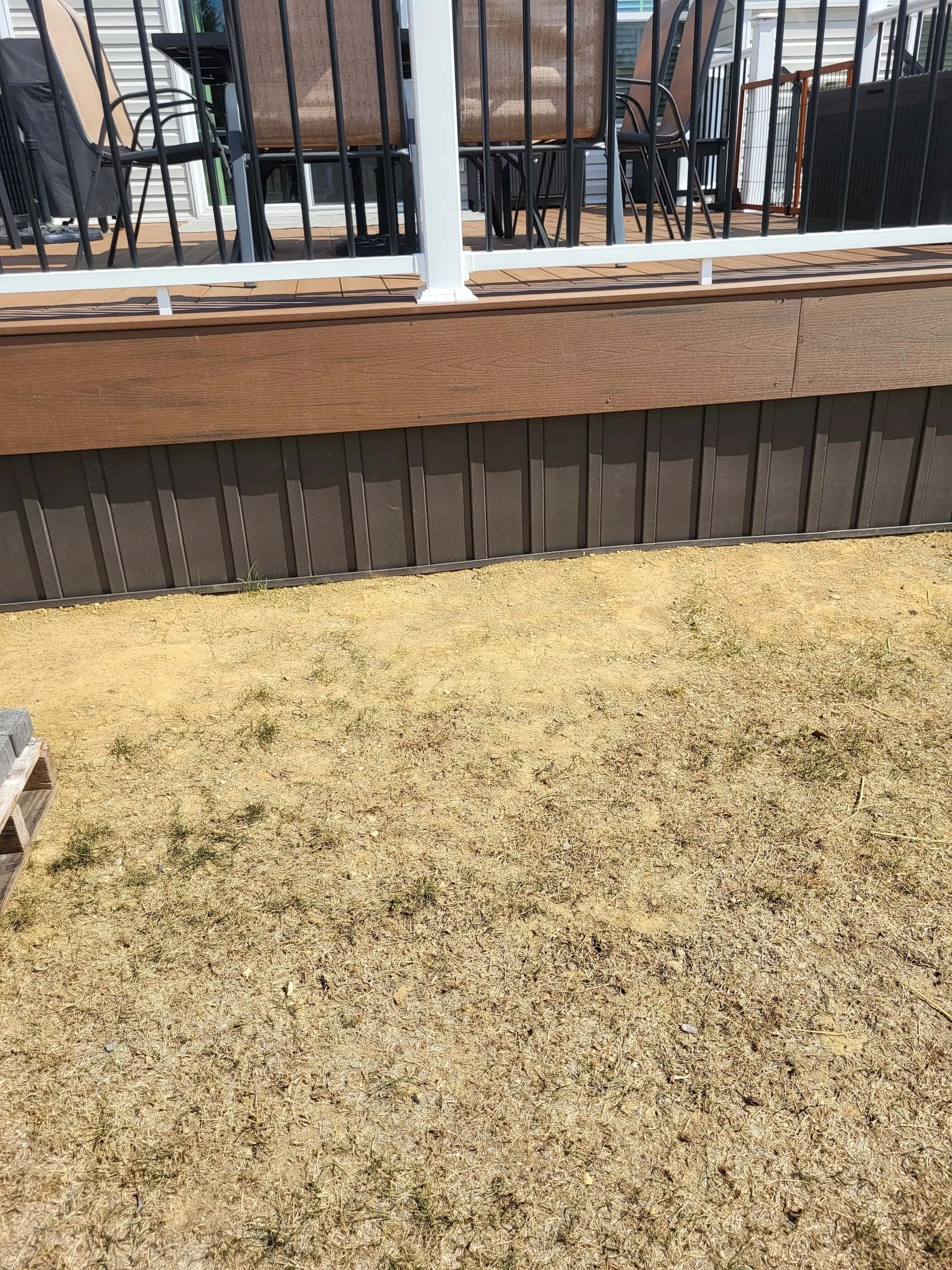 Vinyl board and batten skirting installed instead of traditional lattice under deck