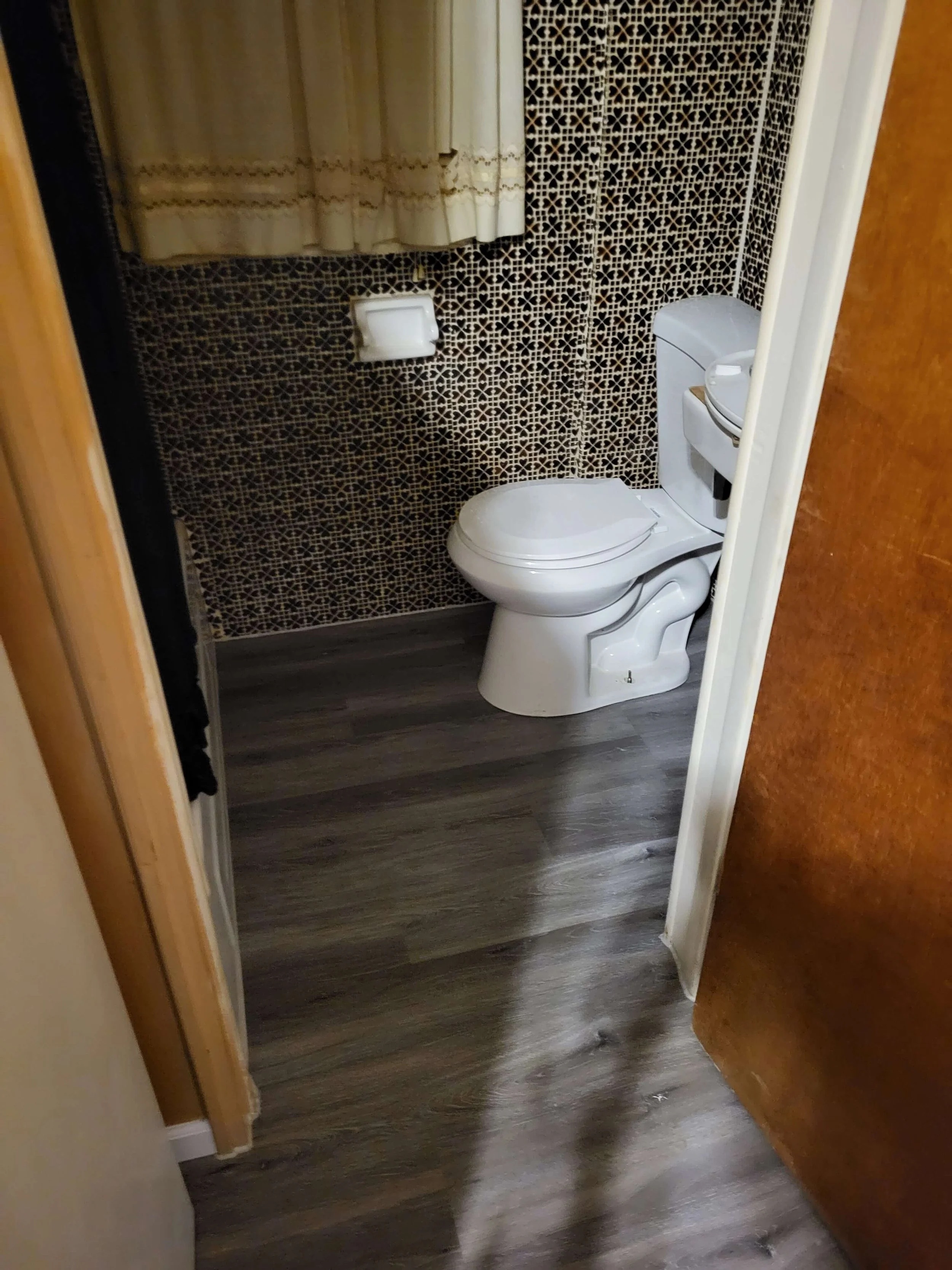 Upstairs toilet replacement and vinyl flooring installation by DLR Construction in Hudson, Ohio.