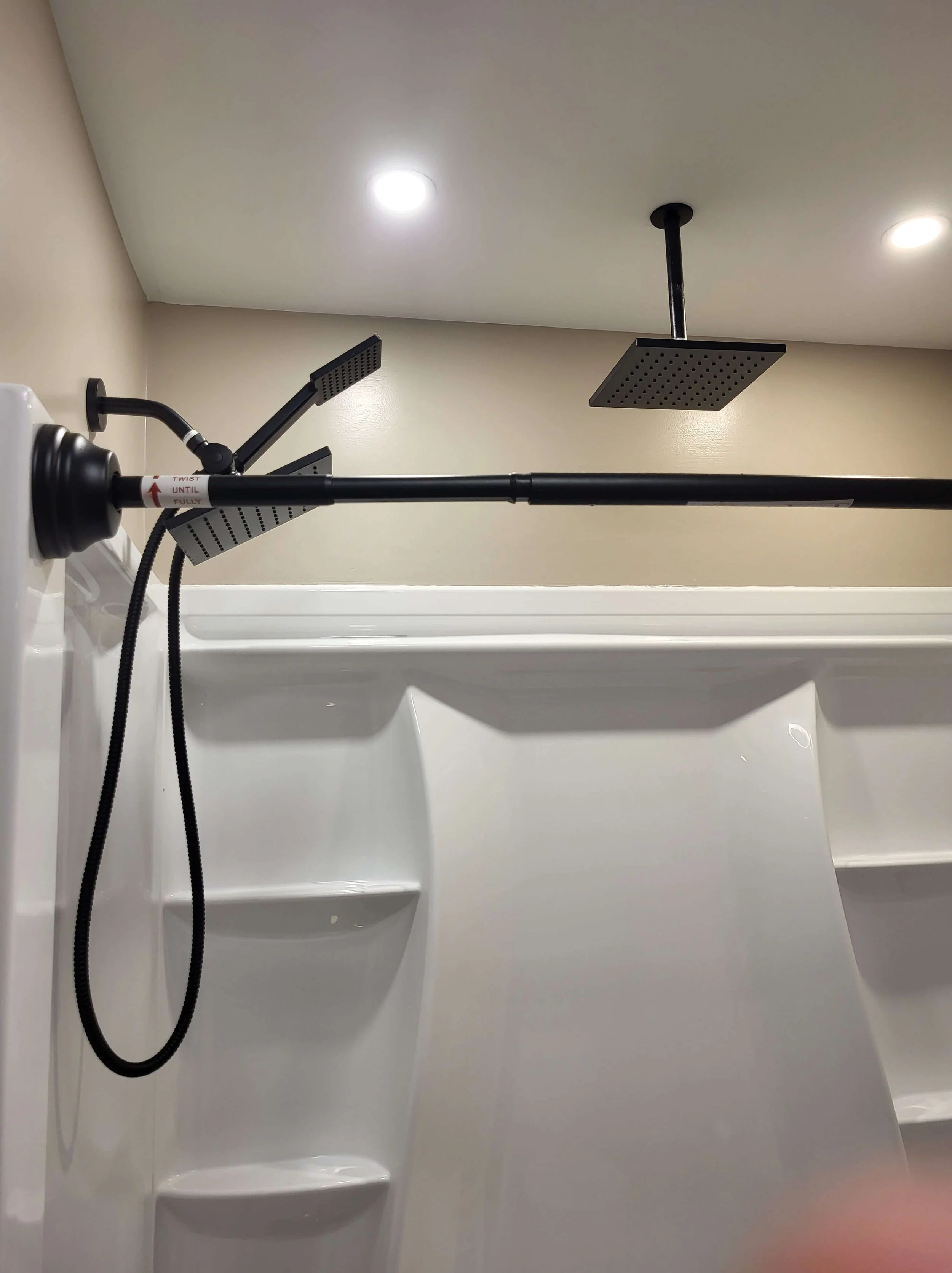 DLR Construction bathroom renovation with a rainfall shower head, and recessed lighting in Cleveland Ohio
