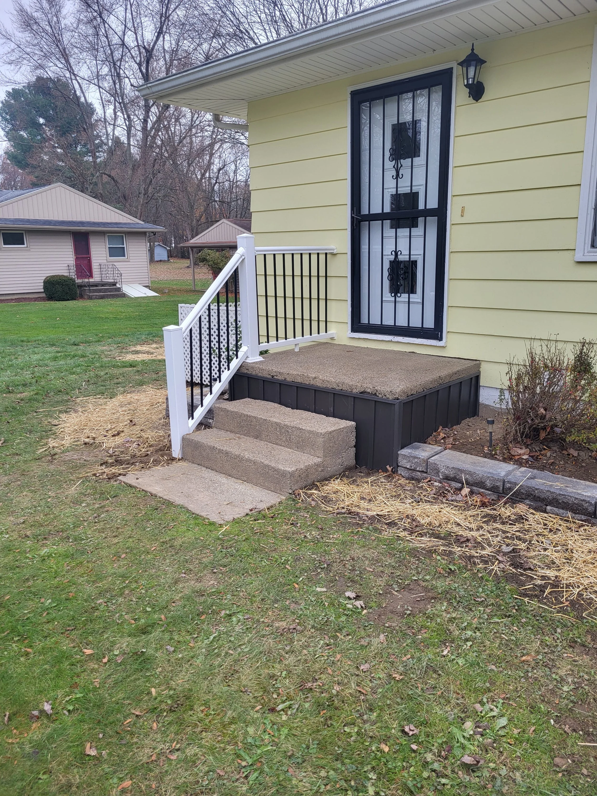 New and Improved Front Entrance With Handrails, spindles, and skirting. Curb appeal Improved.