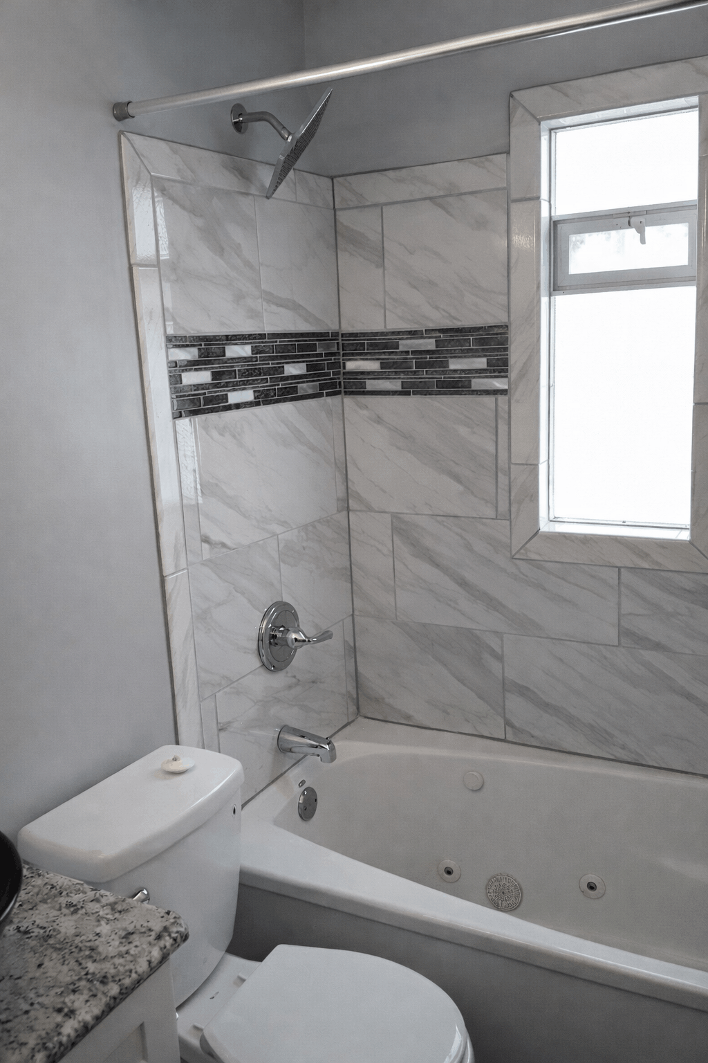 Walk-in Tile Shower with unique shower head and custom tile layout in Cleveland, oh