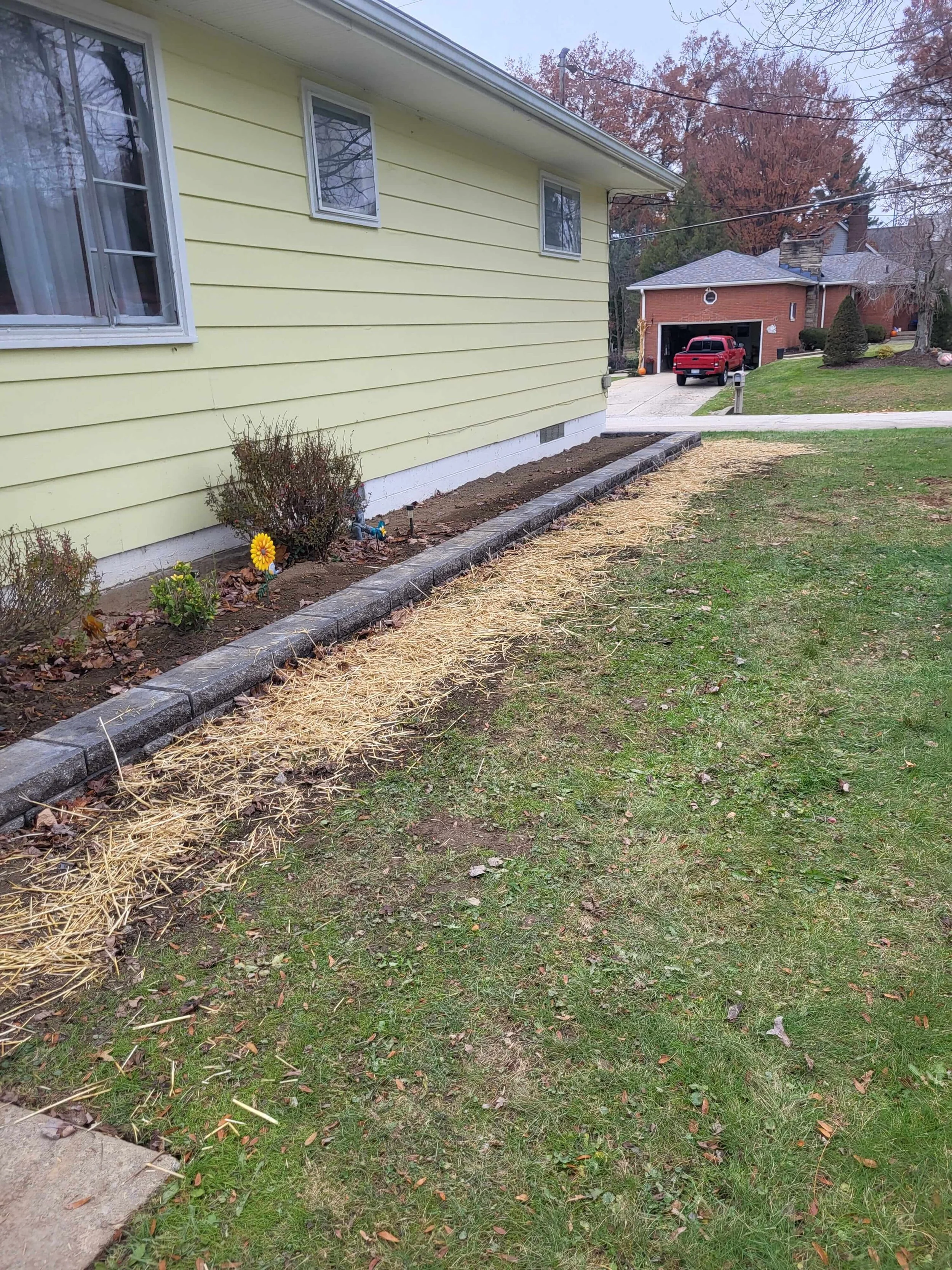 Landscaping, mulch installation with solid landscaping blocks completed by DLR Construction in Cuyahoga Falls.
