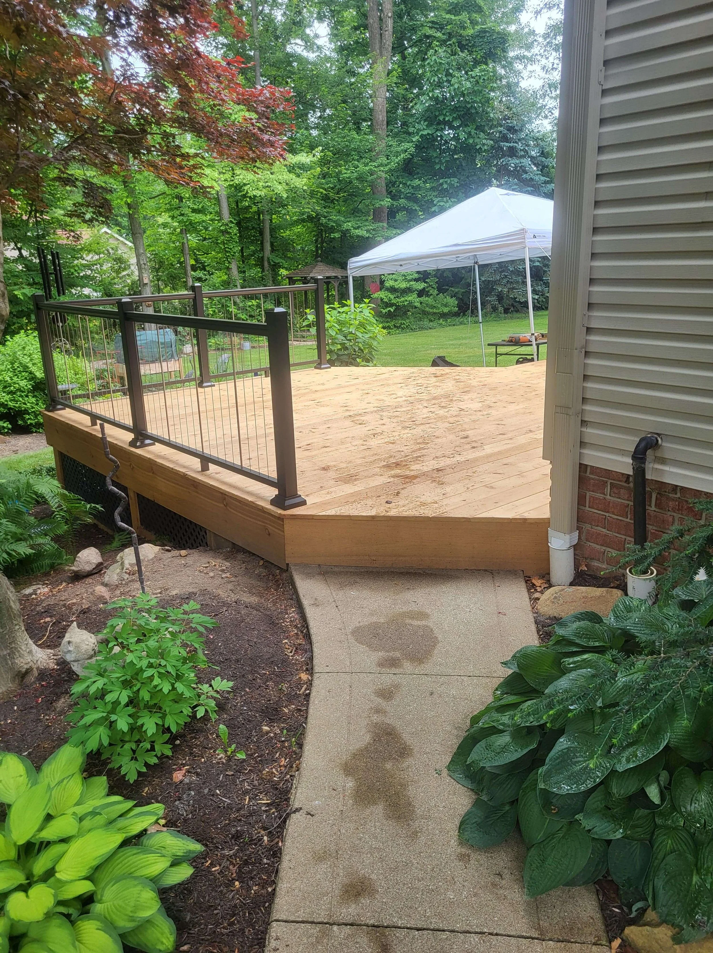 Cedar deck integrated into backyard landscape with clean layout and natural flow in Northeast Ohio