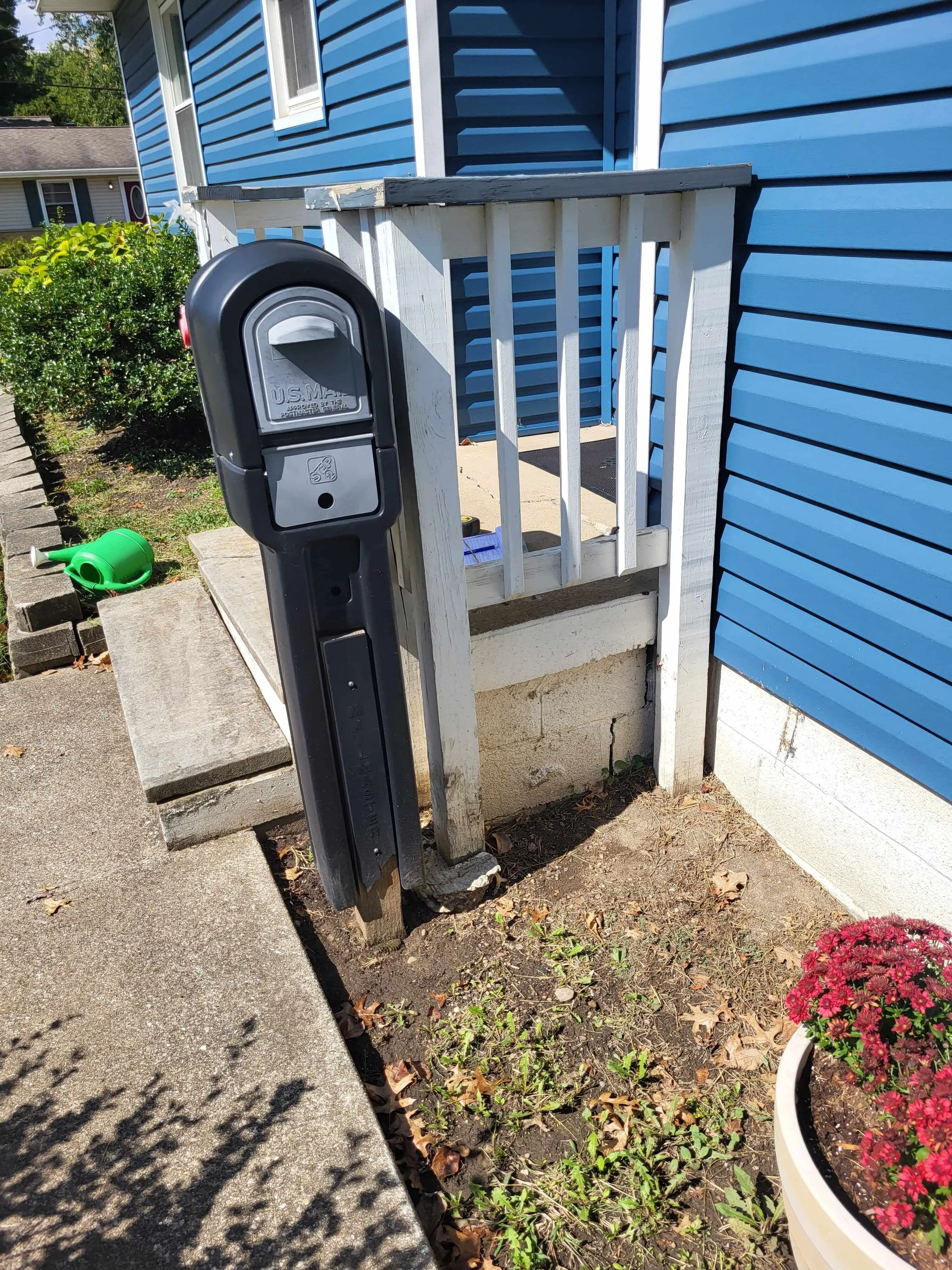 demolition of front entry steps and sidewalk before new deck construction in Akron Ohio