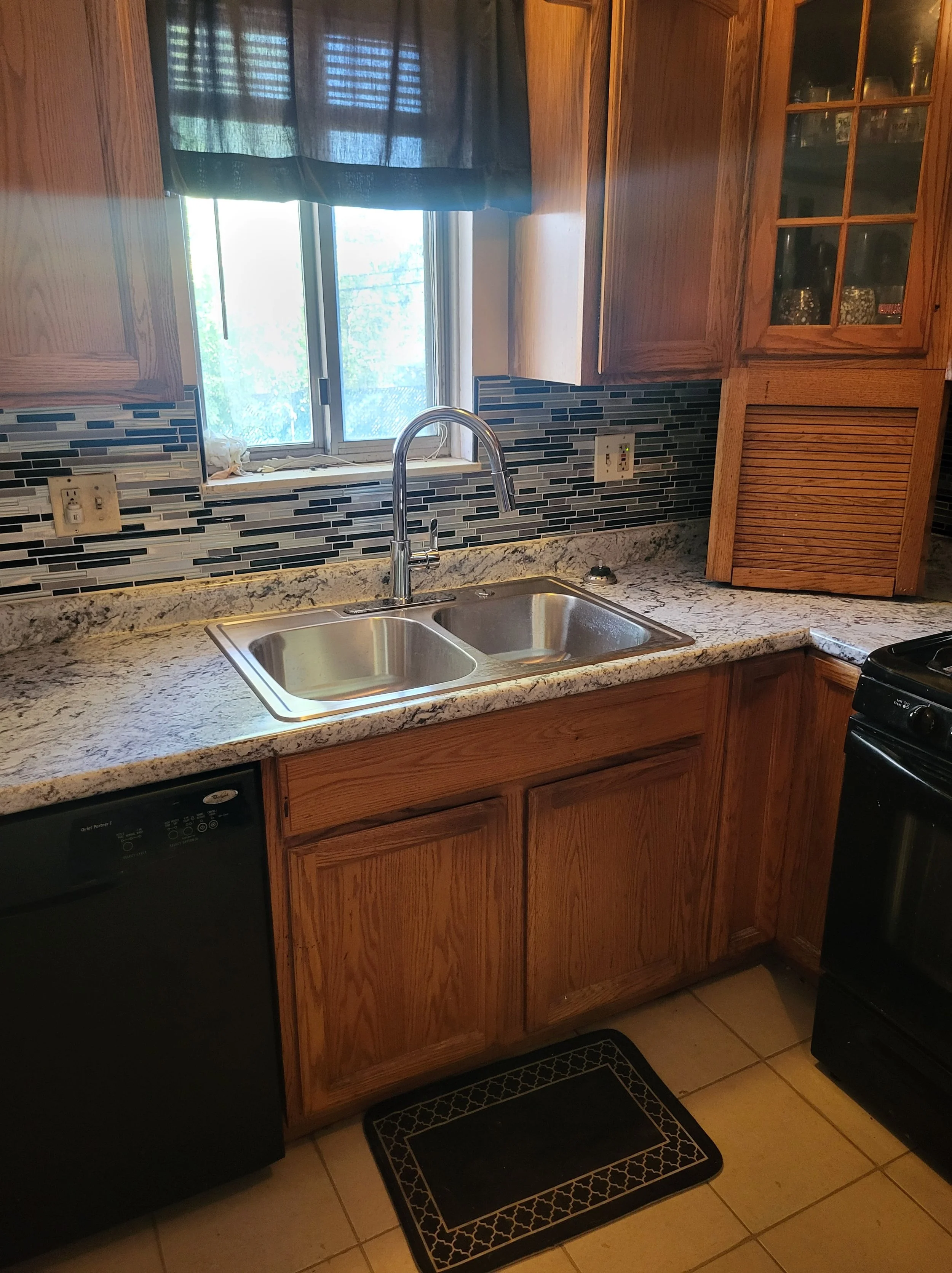 Installment of Kitchen Sink faucet and accommodating plumbing.