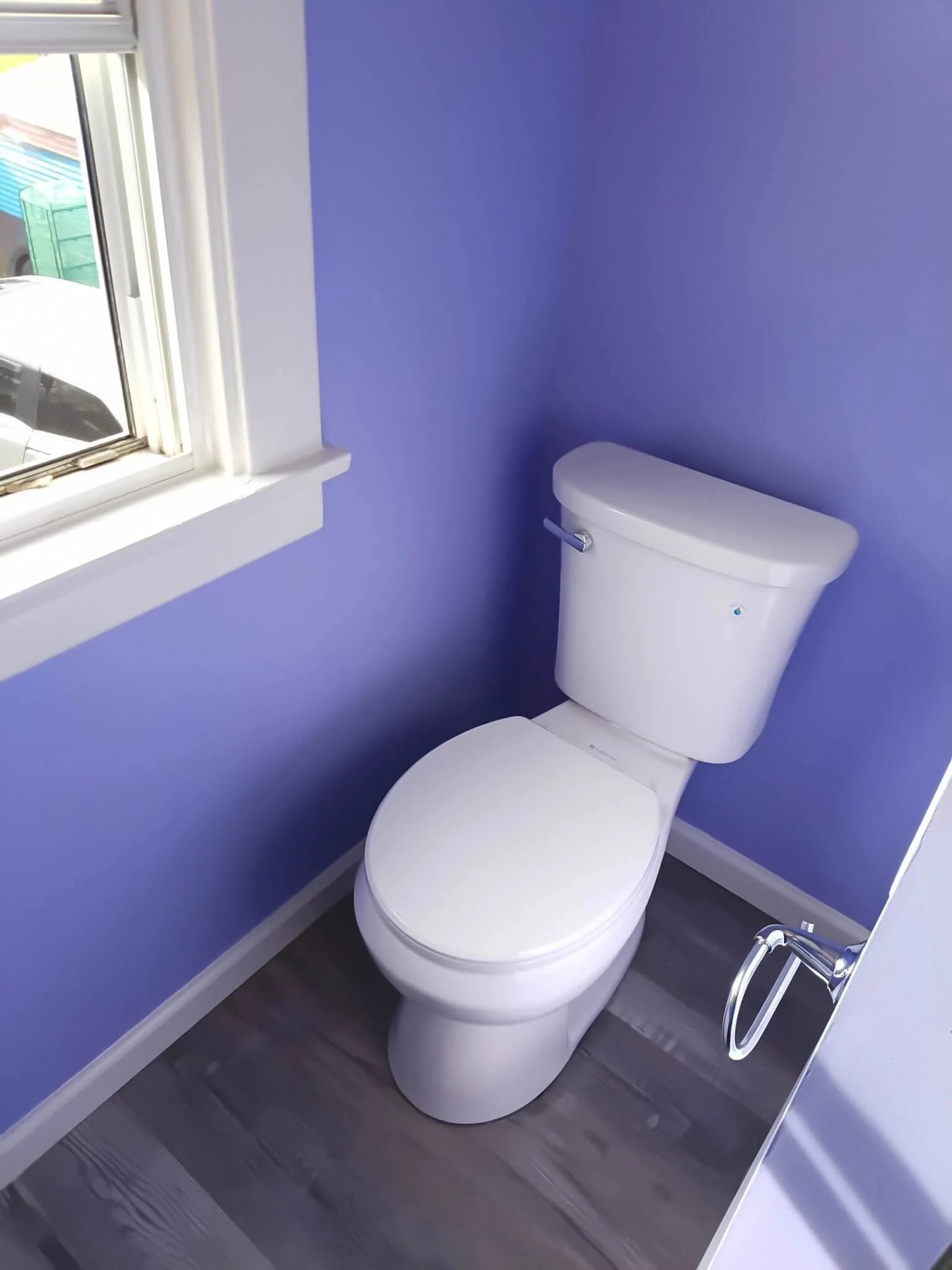 Finished bathroom remodel showing custom partition wall layout by DLR Construction