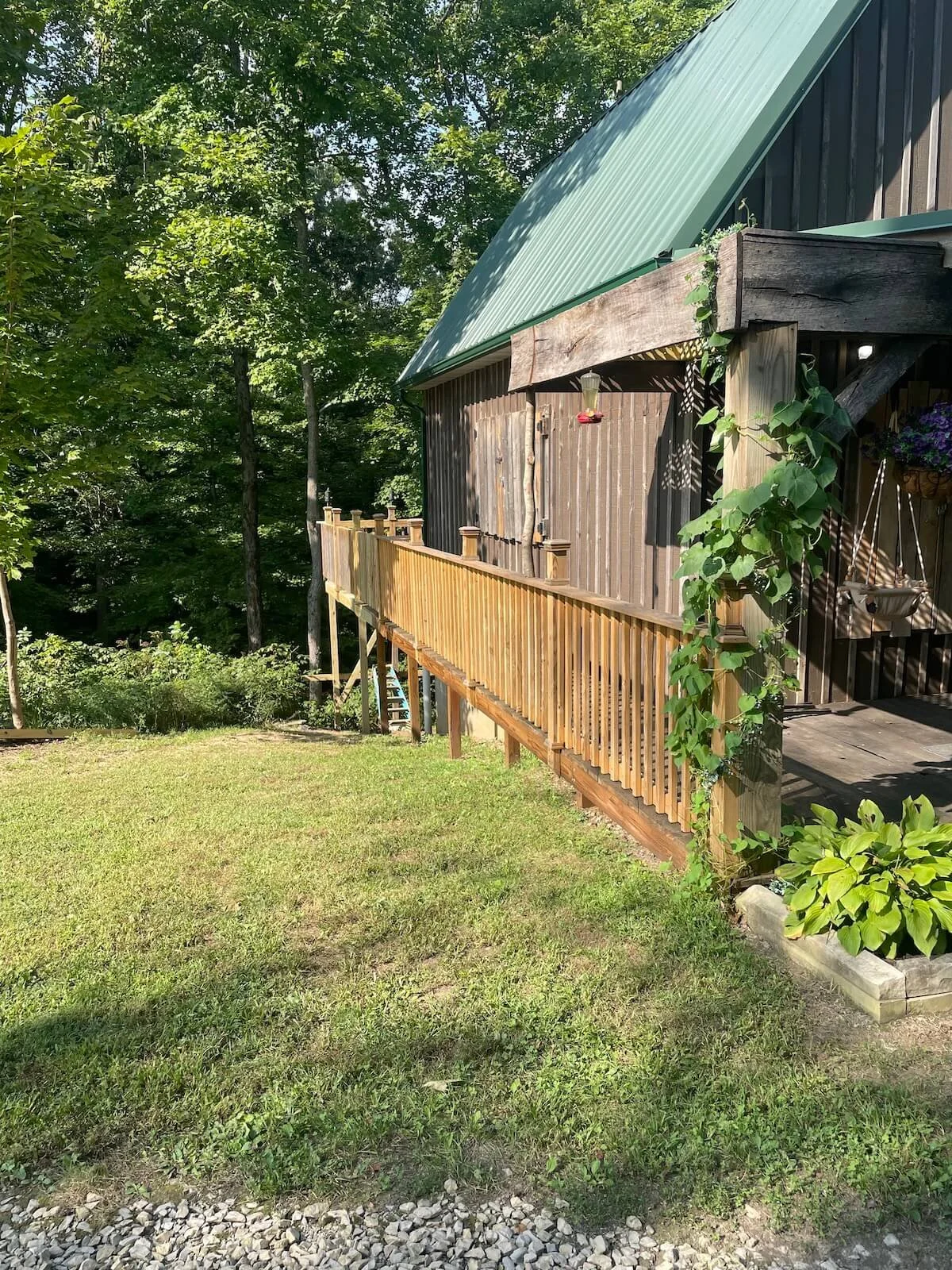 • Custom level deck connector built over a steep hillside grade in Kent Ohio.