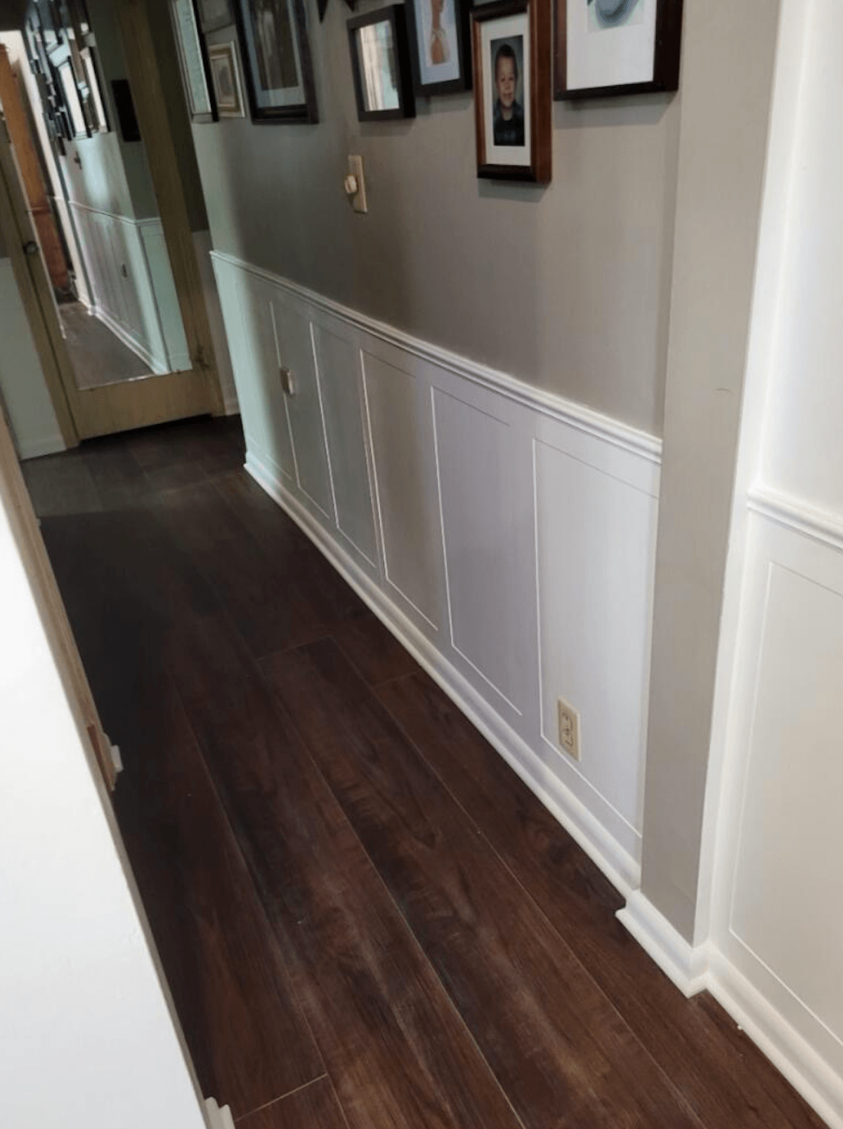 Finished hallway transition featuring custom cut beadboard wainscoting trim work
