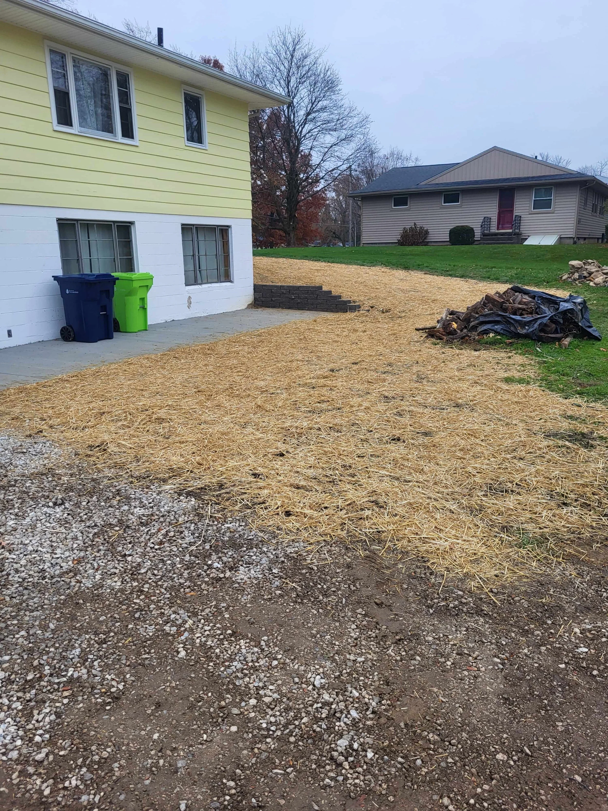 Re-graded landscape swale and downspout drainage solutions by DLR Construction in Cuyahoga Falls.