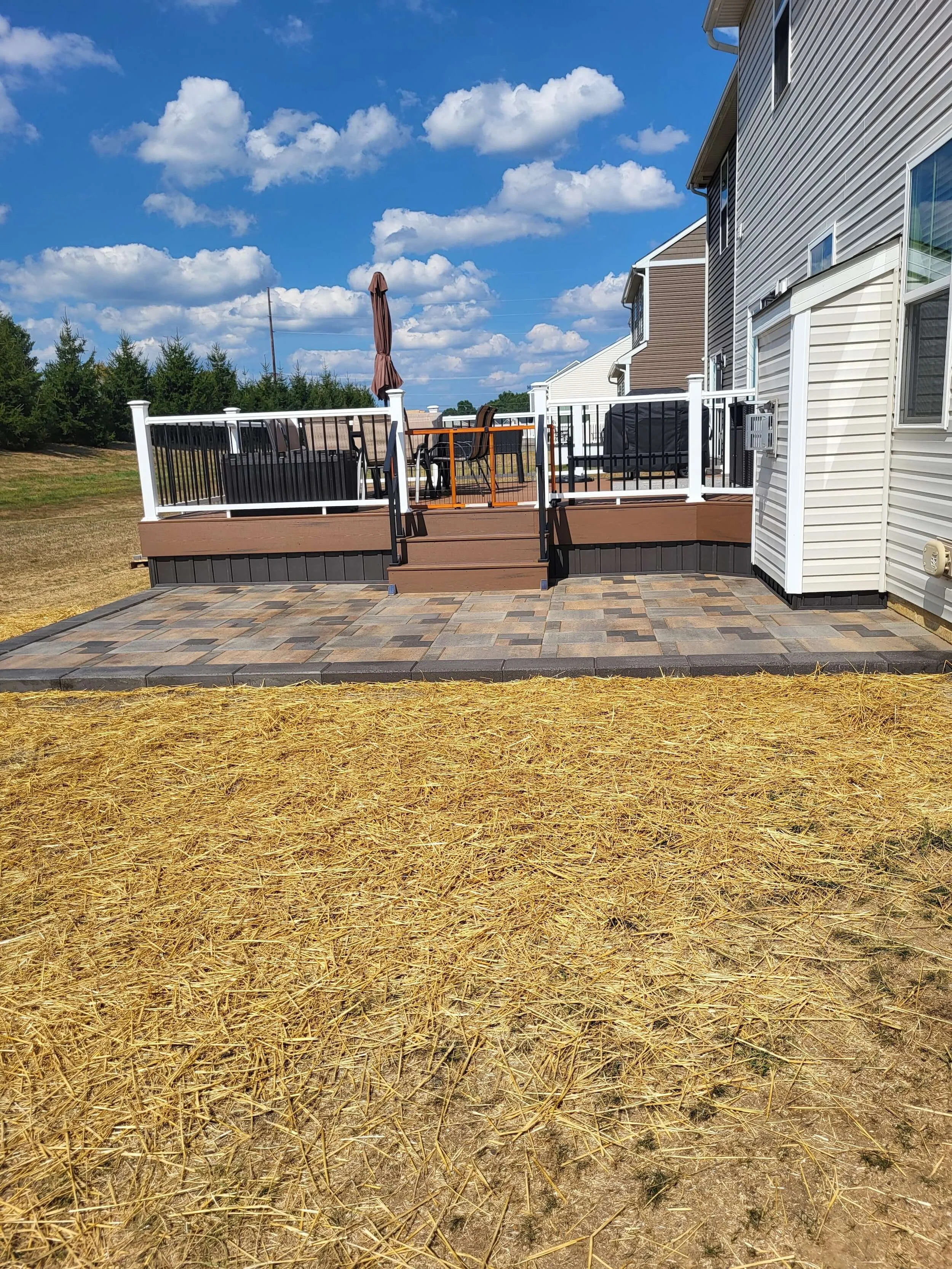 Raised deck with surrounding yard grading and improved drainage slope