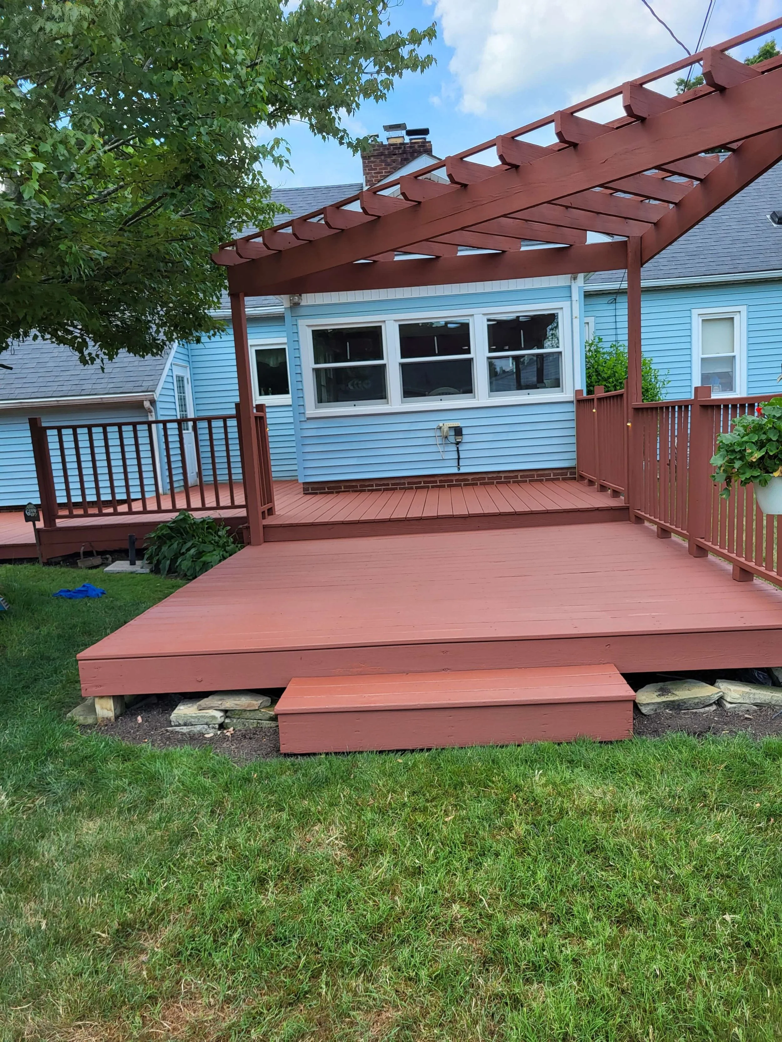 DLR Construction deck restoration with a light orange finish, in Hudson Ohio