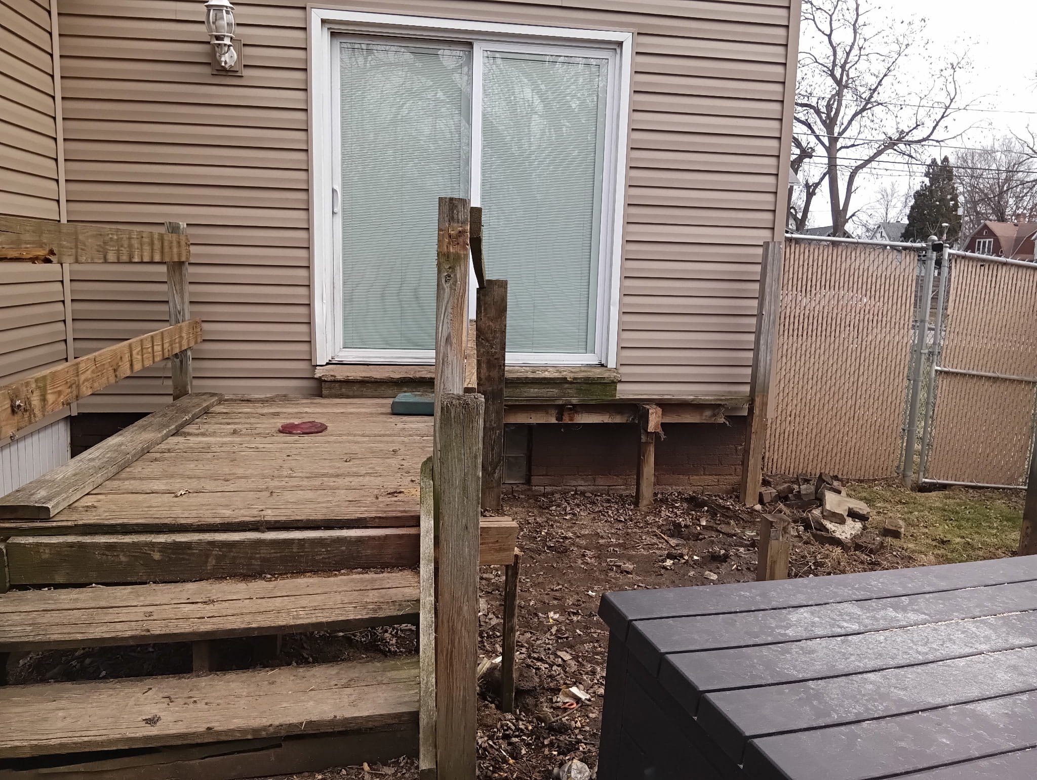 Existing, Sinking, Failing and unsafe Deck and Deck structure that needed replaced. Multiple Rotted out sections