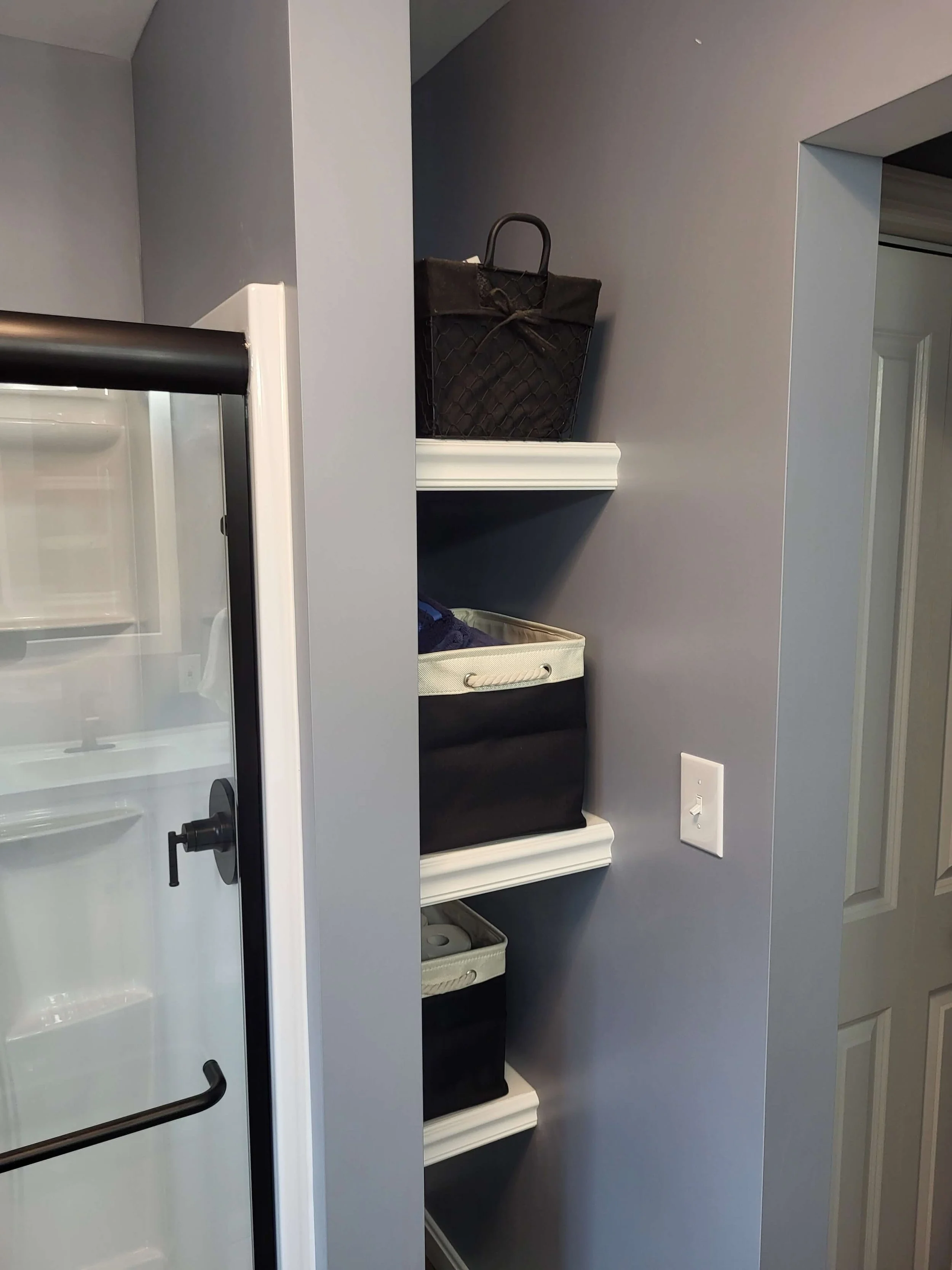 DLR Construction custom walk in tile shower installation with rainfall head and built in shelving completed for a homeowner in Akron Ohio