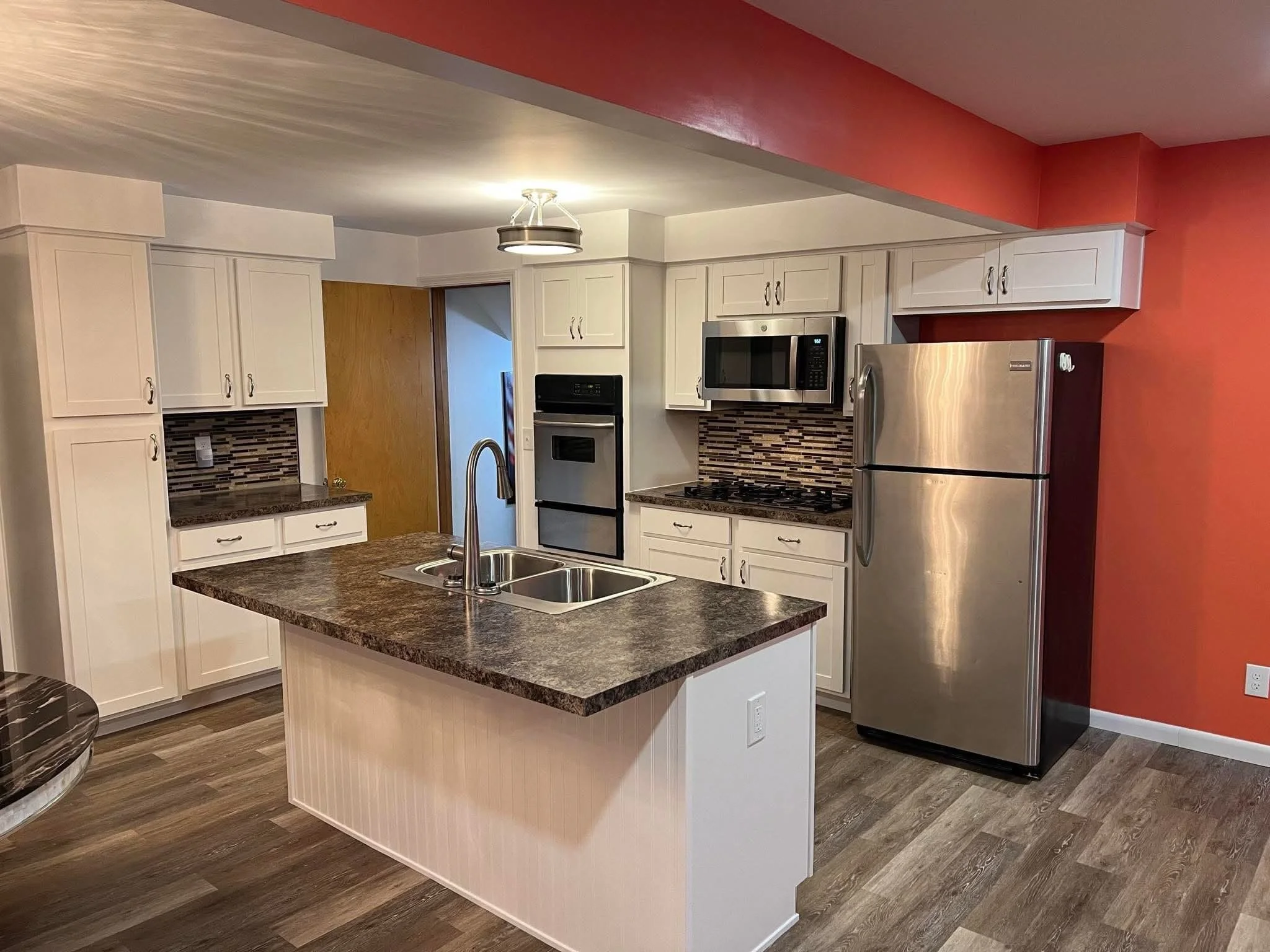 Custom Kitchen Layout, maximizing space. Kitchen Cabinets, Lighting, Flooring, Backsplash installed.